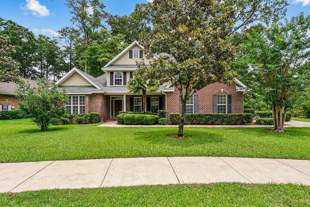 Introducing the sought-after St. Celia floor plan by Key Lime Homes! This beautifully maintained 4BR/3BA two-story home offers a flexible split-bedroom layout ideal for families, guests, or multi-generational living. Two bedrooms and a full bath are upstairs, while downstairs features two additional bedrooms and baths, including a private guest or teen suite.

The spacious kitchen is designed for entertaining with a large center island, Silestone countertops, custom cabinetry, and 42'' upper cabinets with crown molding, plus gas or electric appliance options. Interior upgrades include cultured marble vanities, tubs, and showers, ceramic tile in wet areas, and wood flooring in the dining room, foyer, and oversized first-floor primary suite.

The primary suite measures approximately 23'7'' x 13'4'' and features a custom walk-in closet (13'4'' x 8'11''). Additional living space includes a large Florida Room (27'8'' x 11') and a converted attic office/flex space (approx. 19'3'' x 13') with heating, cooling, and secondary access for extra storage.

Major updates include a new roof (Nov. 2024), new A/C units (2022 & 2023), and expanded septic drain field (2019). A dramatic 20-foot entry ceiling adds to the open and inviting feel of the home. Offering space, flexibility, and quality upgrades throughout, this home is truly a must-see!