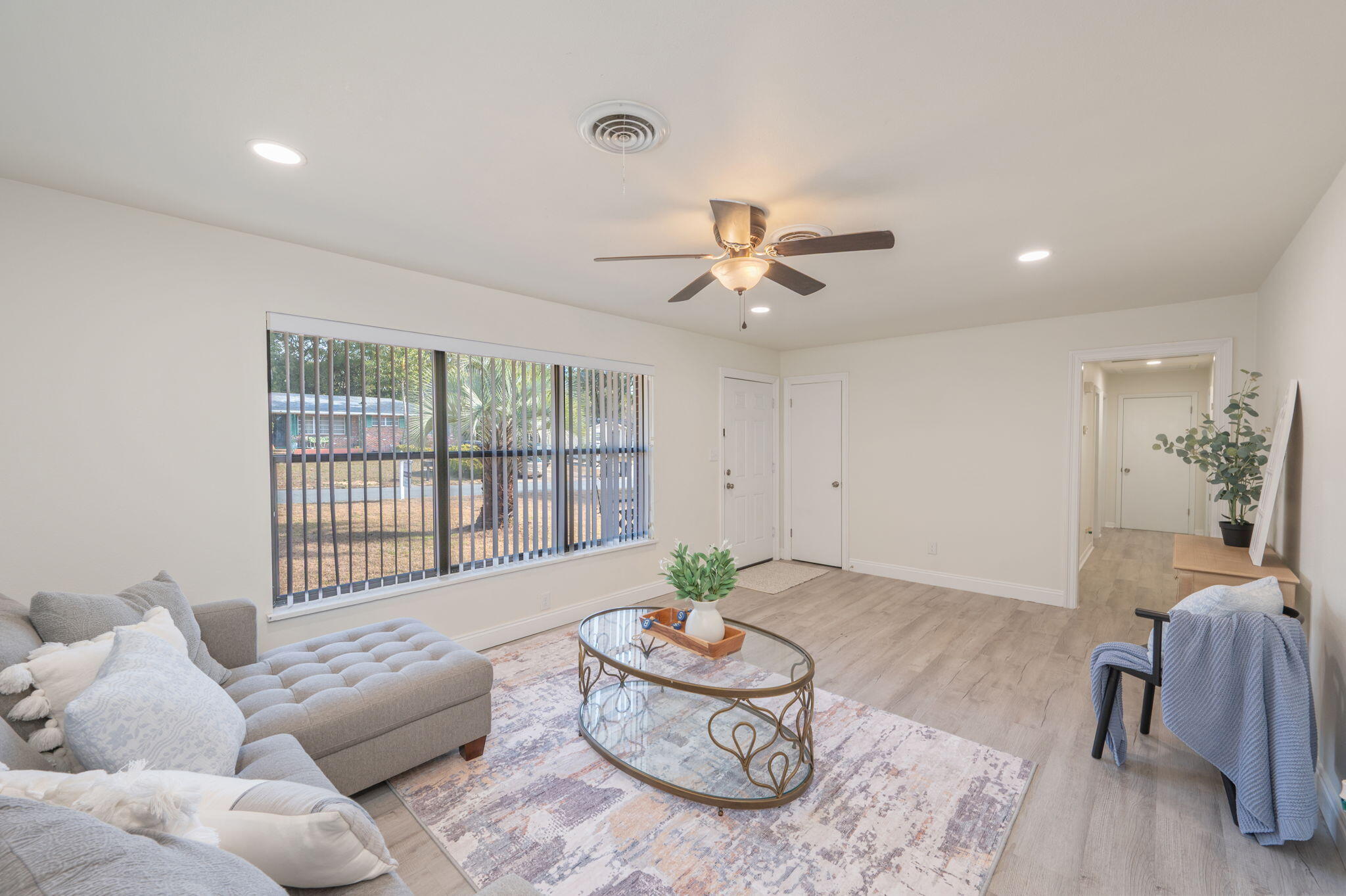 1/2 acre lot shaded by gorgeous mature oak trees, and backing up to military land for privacy, this updated single-family 3/2 home gives space! Perfectly positioned near military bases and sought-after A+ schools, making everyday life beautiful. Versatile spaces such as indoor laundry, bonus enclosed garage (Can easily be converted back to garage!), sun-room and attached workshop are not included in square footage, making this home big on space! Home has been refreshed with neutral flooring, no carpet! Scraped ceilings, no popcorn! Fresh paint, granite counters, and updated baths. Out back, the exterior deck invites gatherings under the trees, while the yard building provides room for projects and storage Gas hookups in the home for versatility. metal roof, newer water heater, newer appliances, full Electrical re-wire, lawn pump and NO HOA, bring your boat or RV and make it your own. Seller will add garage door back prior to closing with acceptable offer.