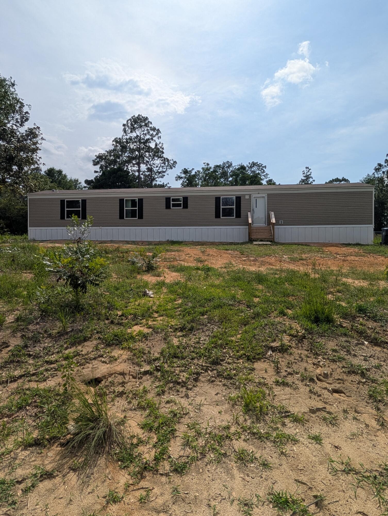 $5,000 closing costs with accepted contract! Brand new 4 bedroom 2 bath mobile home on 1.25 acres. This lot is located in an X flood zone and there is no HOA. Quiet area with a huge lot. Plenty of room for a garden, outbuildings and 4 wheelers. Spacious floor plan with 3 bedrooms and bonus room that can be used for an office or another bedroom as needed. Enjoy an affordable homeownership opportunity! This property may qualify for USDA 100% financing for eligible buyers, with additional low-down payment and closing cost assistance programs potentially available also. Contact selling agent for lending options!