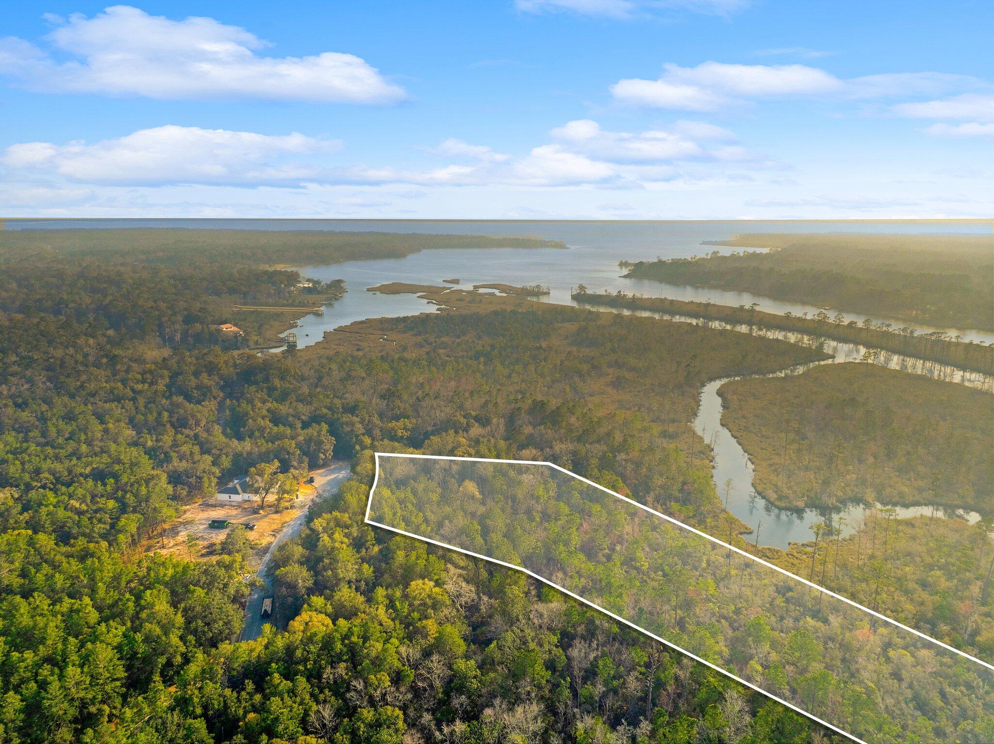 Build your dream home on this 1.5 acre waterfront lot in the gated community of Magnolia Bay Estates. Enjoy 81' of frontage on Goodwin Greek - navigable to Alaqua Bayou and Choctawhatchee Bay.

32 acre of upland buildable and in Flood Zone X. Water and sewer tap fees have been paid and will convey. Connection fee due when building begins.

Convenient location in a serene setting - minutes to Freeport shopping and less than 30 minutes to the beaches.