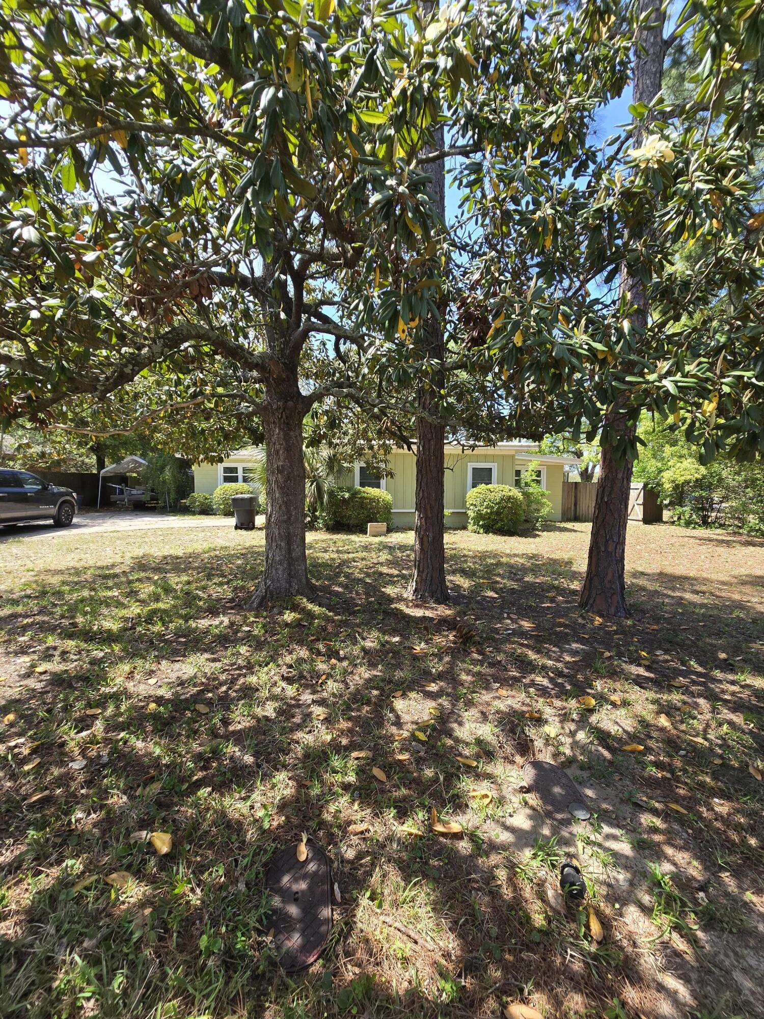 This Elliot Point HOME is CONVENIENTLY located between Military Bases, Shopping and Schools, and of course close to the BEACH!  This home features  4 Bedrooms, Large Dinning Room, OFFICE, Living Room with a FIREPLACE, Large SCREENED in Porch, ALL ON A LARGE privacy FENCED in Yard that abuts Ferry Park.  The BACK YARD has large SHADE TREES, a place for a GARDEN, AND a place the KIDS can PLAY BALL!  Seller has installed New Flooring throughout the home and it is Freshly Painted!  Call for more information!