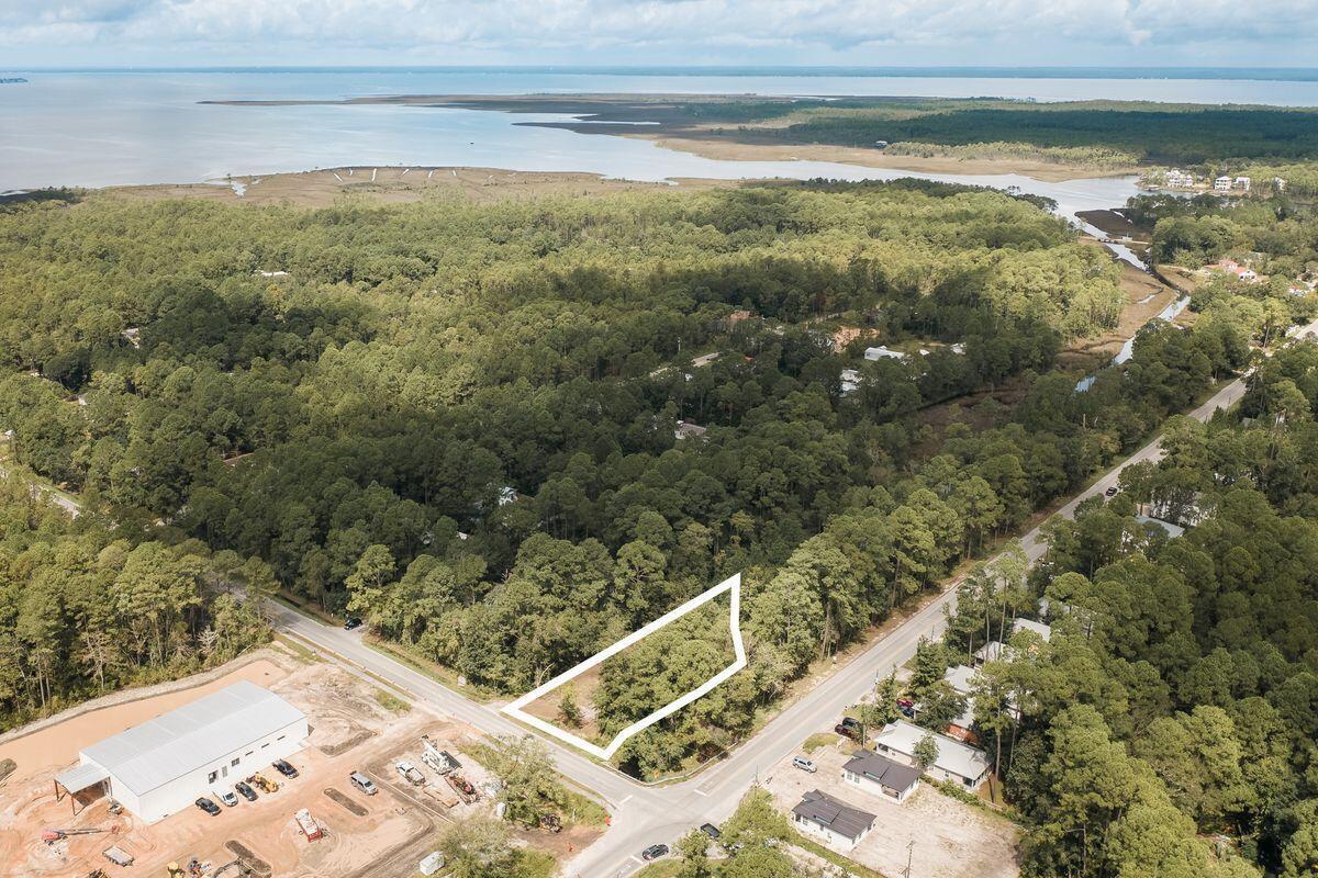 Build your dream home on this spacious .21-acre homesite ideally positioned near both the bay and the beaches of South Walton. Located north of Highway 98 at the corner of Churchill Bayou Road, County Highway 393, and Chat Holley Road, this mostly cleared lot offers an exceptional opportunity to create a custom residence without the restrictions of an HOA. Hogtown Bayou borders the eastern side of the property (Very Shallow), providing a peaceful natural backdrop and added privacy. Enjoy the convenience of being just minutes from the water, with Cessna Landing's public boat launch nearby for easy access to Choctawhatchee Bay. The sugar-white sands and emerald waters of the Gulf are also within easy reach, as the property is approximately 3 miles from the west end of Scenic Highway 30A, Gulf Place, and the popular Ed Walline Beach Access.

Whether you're seeking a primary residence, second home, or investment opportunity, this homesite offers the perfect blend of coastal convenience, natural beauty, and an unbeatable South Walton location.