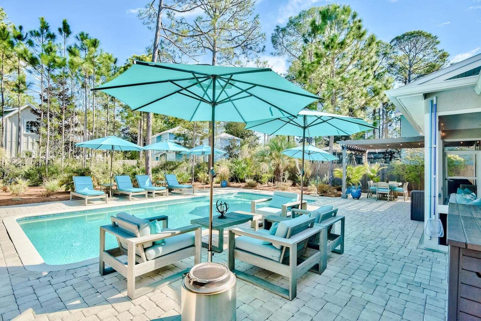 Beautifully updated Ranch style home in the amazing Sugarwood Beach community sits on the largest usable lot in the neighborhood. The backyard is private & has a saline, heated pool with smart controls. An exterior, private, open-air full bath adds a sense of luxury & ease. The beautiful Pergola & paved patio lead inside through the screened entertainment porch. Windows & doors are impact rated, added in 2020, along with the metal roof. Upgrades are abundant. Enjoy zoned living with capability of privacy shutout for guest bedrooms & bath, while the Master Suite resides in its own wing. This is a rare opportunity for open, one-story living, with an extra-large preserve of Seagrove paradise out the back door.