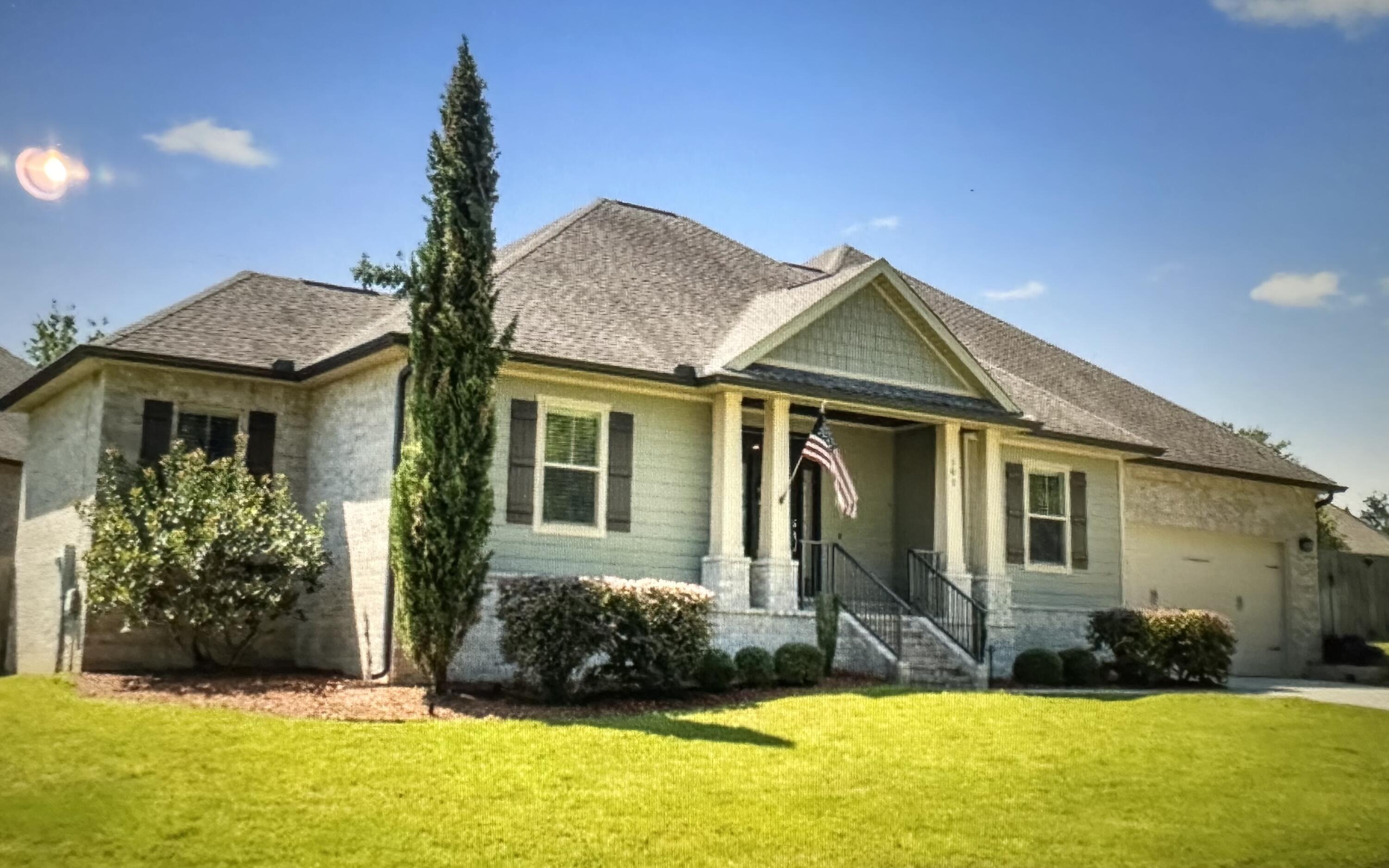 This custom built home by Wilson Enterprises, NWFL. is a Parade of Homes winner. This 4 bedroom /2 full bath very open split floor plan located in South Crestview is full of upgrades  PLUS, it has an additional office/media room. Take the brick stairs up the front entry to a gorgeous covered porch with a wood ceiling. Inside you'll love the wood look tile throughout  and the shiplap wall entry. The living room features a vaulted ceiling with recessed LED lighting, a gas fireplace, and surround sound, and is open to an expansive eat in kitchen complete with huge island, tall pristine white cabinets, and a gas stove and sleek granite counter tops. The large screened in back porch is the perfect place to hang out or enjoy a dip in the hot tub.