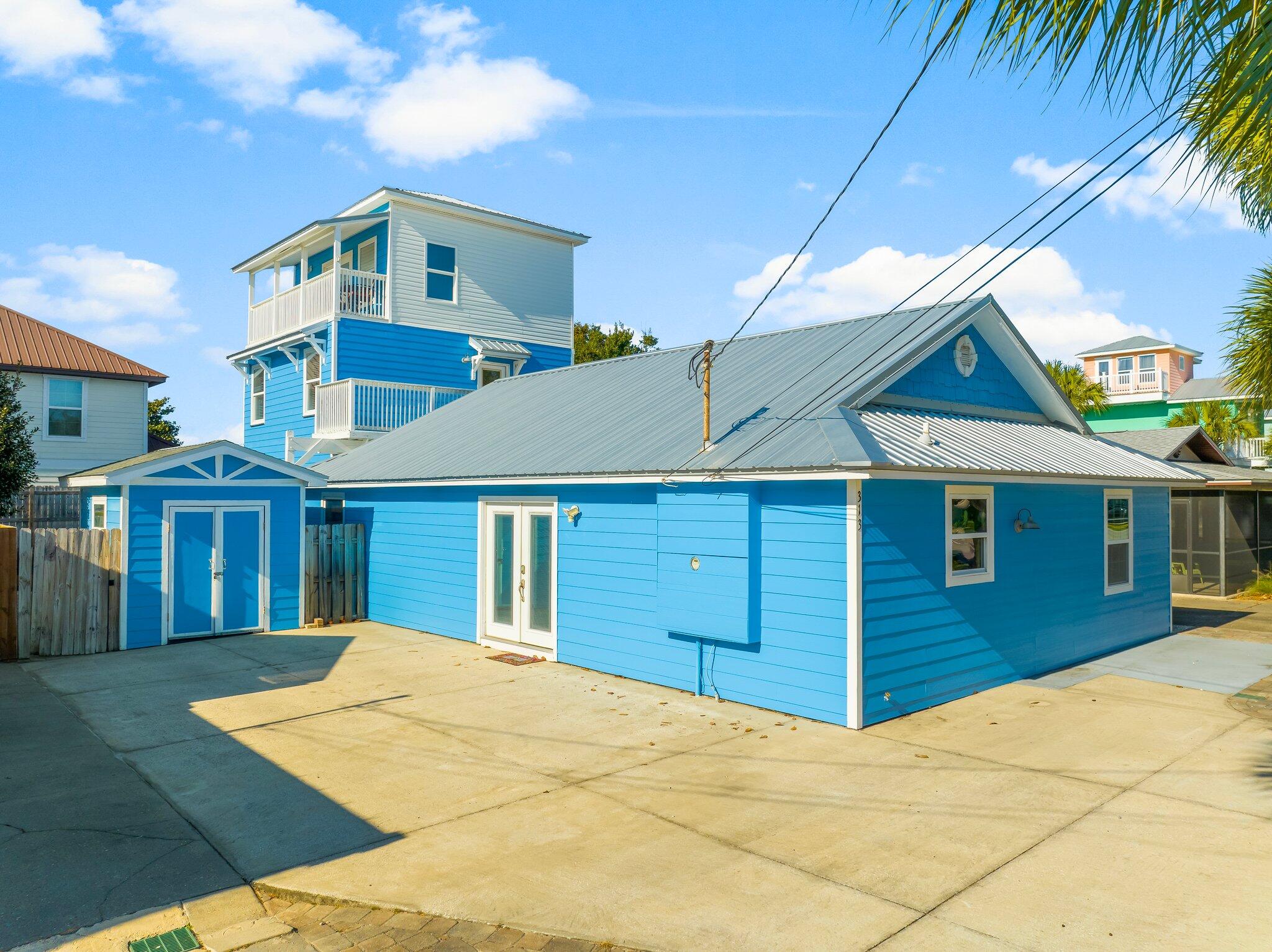 CURRENTLY UNDER CONTRACT, SELLER WILL CONSIDER BACKUP OFFERS 5BR coastal home with Gulf view from 3rd-floor balcony, metal roof 2021, private beach access, fenced yard, and no short-term rentals. This five-bedroom home is located in the Bid-A-Wee Beach residential neighborhood and features a multi-level layout, outdoor living spaces, and a Gulf-view balcony on the third floor. The main living level features an open-concept design with wood-look flooring, ceiling fans, and access to outdoor areas. The kitchen features granite countertops, raised-panel cabinetry with crown molding, stainless steel appliances, a large center island, a glass mosaic tile backsplash, a beadboard ceiling, and recessed and pendant lighting. Bedrooms are arranged across multiple levels, allowing flexibility for full-time living or long-term leasing. Bathrooms include tub-and-shower combinations and a walk-in tiled shower with a glass enclosure. A dedicated laundry room includes a washer, dryer, and water heater. Outdoor features include a covered, ground-level entertaining area with ceiling fans, a fenced backyard, a paver patio with a hot tub, and multiple balconies. From the third-floor balcony, there is a visible view of the Gulf. The home has a metal roof installed in 2021. Short-term rentals are not permitted; long-term rentals are allowed. Conveniently located near Front Beach Road with access to dining, shopping, and local amenities while remaining within a primarily residential coastal community. Contact your agent to schedule a private showing or request additional information.