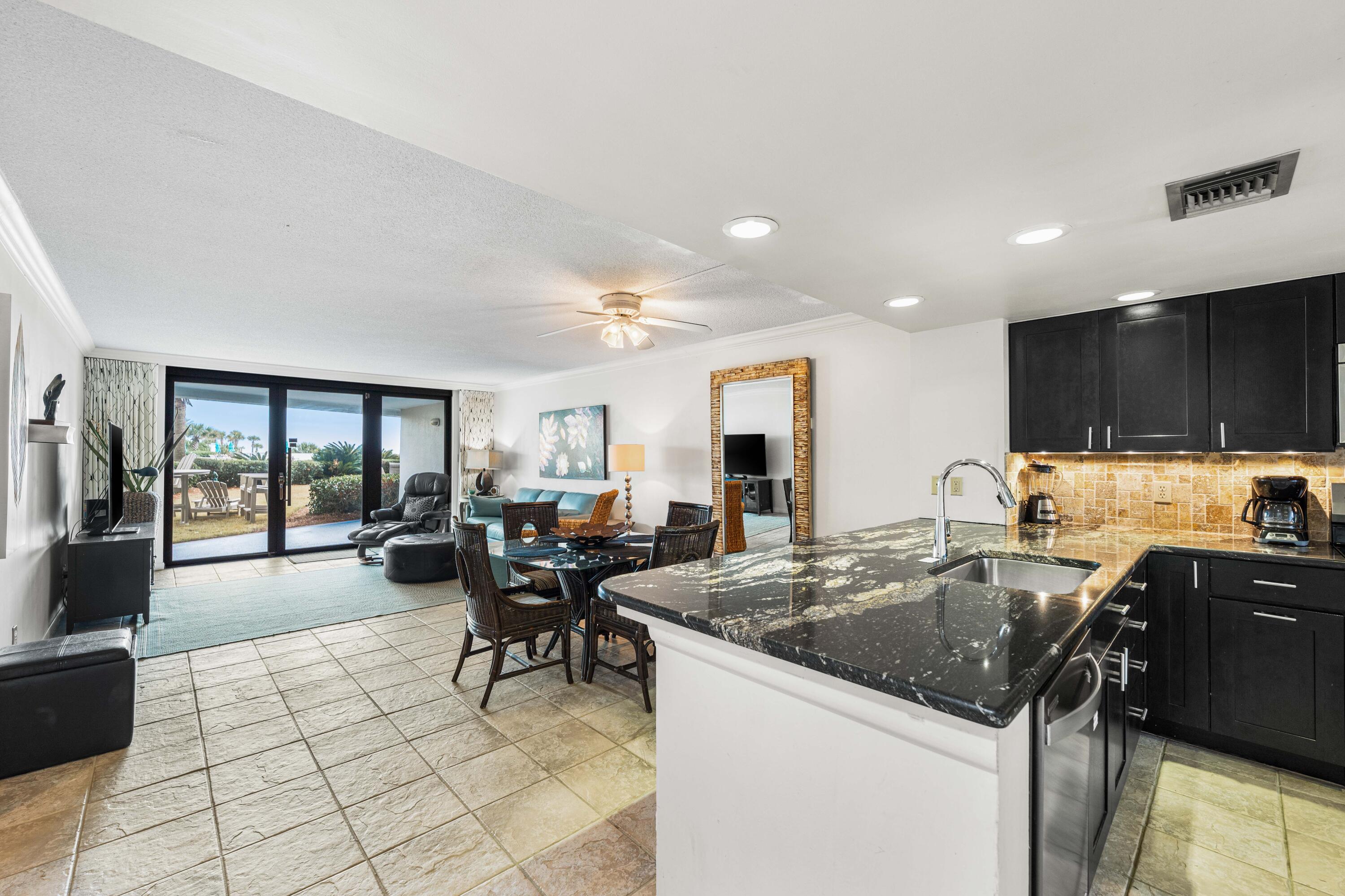 LOWEST PRICE 1 BEDROOM UNIT AVAILABLE IN EDGEWATER! This unit blends comfort & convenience with coastal living! A great opportunity for an investment, second home, or primary residence. Stepping inside you'll find an open floor concept seamlessly connecting the Kitchen, Dining Area and Living Room. The kitchen hosts soft-close cabinets & drawers, breakfast bar, modern stainless steel appliances, dimmable lighting, and ample storage to stash kitchen necessities like dishware and beach snacks. The spacious living room offers owners and guests a walk-out patio, offering direct access to the community's Resort-Style Amenities including Multiple Pools, Playground, approximately 425' of Gulf Coast Beach and MORE!