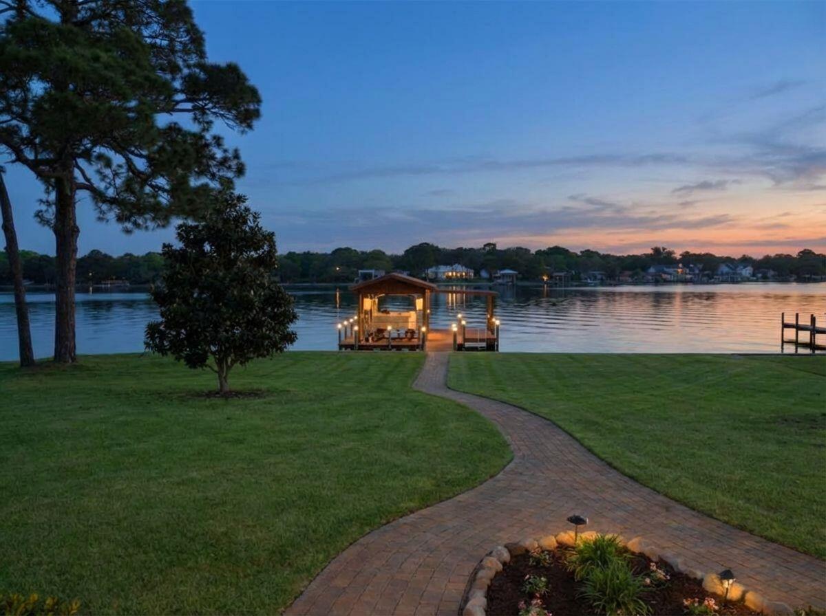 Magnificent one owner, custom built waterfront estate in coveted/protected Cinco Bayou--offered for the first time on the market. This impeccably maintained, single level 4 bedroom, 3 bath home showcases exceptional craftsmanship, deep water access, and stunning  unobstructed waterfront views from the master suite, great room, chef's kitchen, and guest room. Built with all brick construction, soaring 11-13 ft ceilings, impact rated windows and doors, a geothermal energy system, and beautifully landscaped grounds, the property delivers both elegance and efficiency. The expansive covered lanai with a full outdoor kitchen creates effortless indoor outdoor living, while the oversized 3 car garage with deep bays and attic storage provides abundant space for vehicles and hobbies. (see remarks) This home has beautiful hardwood floors and are in pristine condition.

A covered dock with a 2012 commercial grade seawall, boat lift, electricity, and fresh water makes boating a breeze. With no HOA and ample room to add a pool, build an accessory dwelling unit, park an RV, or store a boat trailer, the flexibility is unmatched. 

Minutes by boat to the Destin Pass, Choctawhatchee Bay, the Intra-coastal waterway, and the Gulf of America, this home is an a avid boater's/fisherman's dream, a great get-a-way for an out of town owner, or a perfect place to live year round.

In a market where undeveloped waterfront lots alone are exceeding $1M--and where new construction or reconstructive renovations require significant time and investment which could easily exceed $700K --this move-in ready custom home offers exceptional quality, value, and the opportunity to enjoy the waterfront lifestyle almost immediately.
