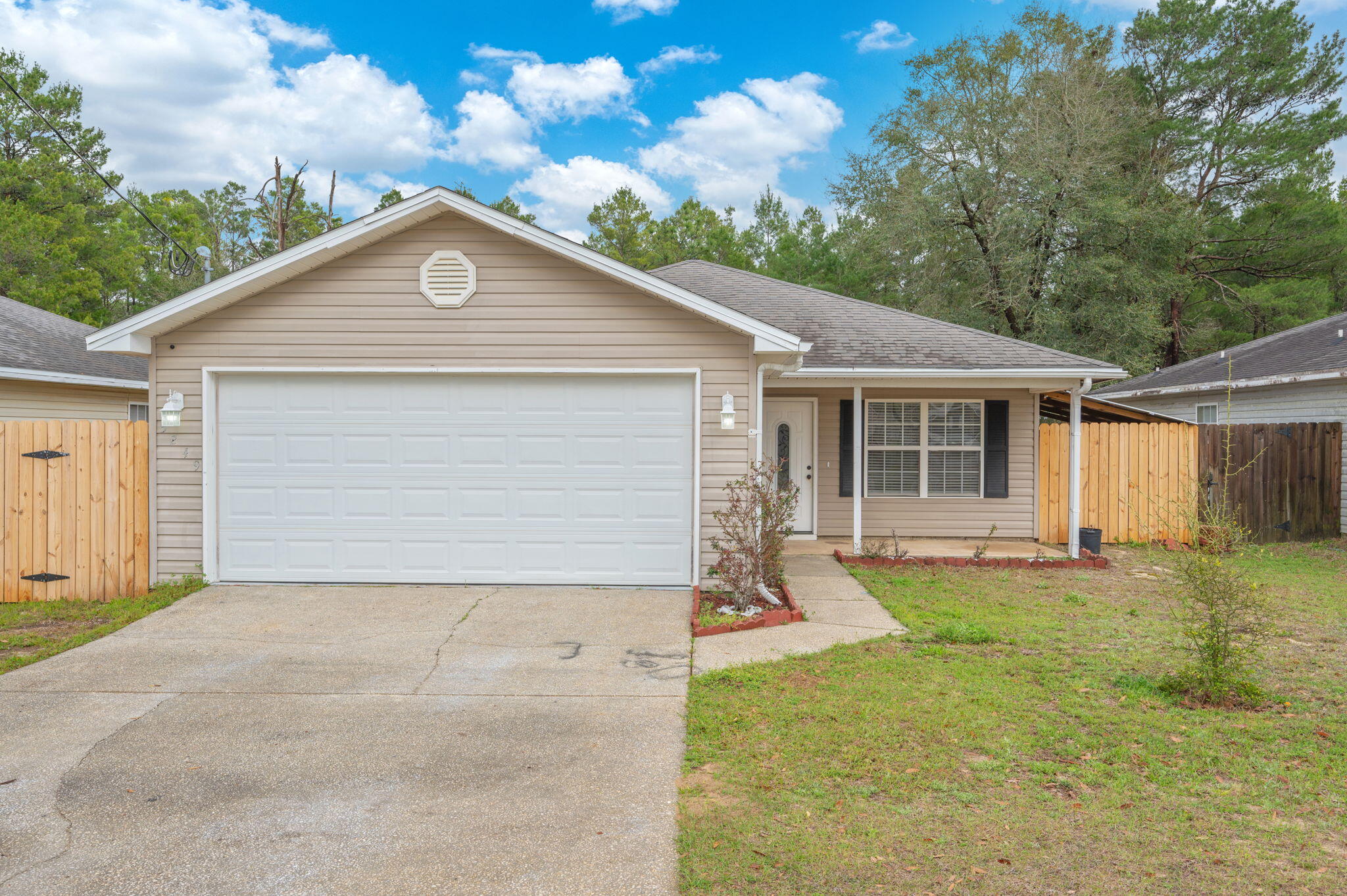 Are you looking for convenience? This home provides easy access to all things Crestview has to offer, plus a quick commute to local military bases and the stunning white-sandy beaches in Destin along the Emerald Coast.
Inside, you'll find a semi-open floor plan that offers the perfect balance of connectivity and defined living spaces. The spacious living area flows seamlessly into the kitchen, featuring granite countertops, ample cabinetry, and plenty of prep space for everyday meals or hosting family and friends. Luxury vinyl plank flooring runs throughout the home, providing both durability and a clean, modern look. Step outside to enjoy the newly installed privacy fence, creating a secure and inviting backyard space that's perfect for family and friends!