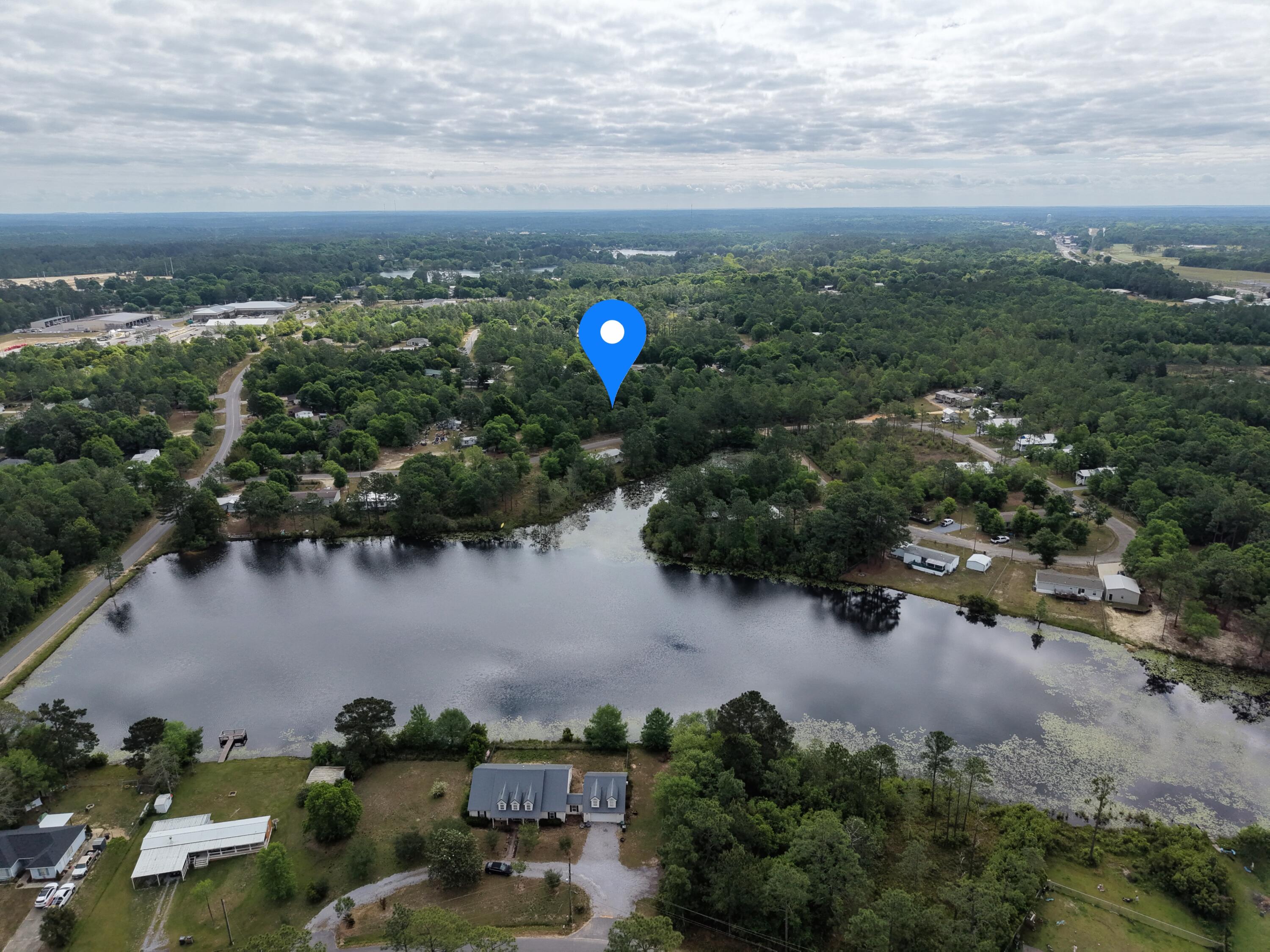 Steps from King's Lake - Build-Ready Lot in Oakwood Lake Estates

This 0.65-acre residential lot is located in an established neighborhood just off King's Lake. From aerial view, the area may appear more rural, but on the ground it's an active community with a steady, everyday presence.  

Zoning allows for a site-built home, manufactured home, or tiny home. City water is available (no well needed), and an electric pole is located at the road, making development more straightforward. 

A practical option for buyers looking to build, invest, or hold land in the King's Lake area.

Seller will remove the existing uninhabitable mobile home from the rear of the property. It is partially cleared and wooded, offering a balance of privacy and usable space for building. Enjoy close proximity to multiple lakes throughout Oakwood Lake Estates, with fishing and outdoor access just a short walk away. 

Located in a residential area with a mix of newer brick homes and manufactured homes, this lot offers a practical option for buyers looking to build, invest, or place a home in an established neighborhood.