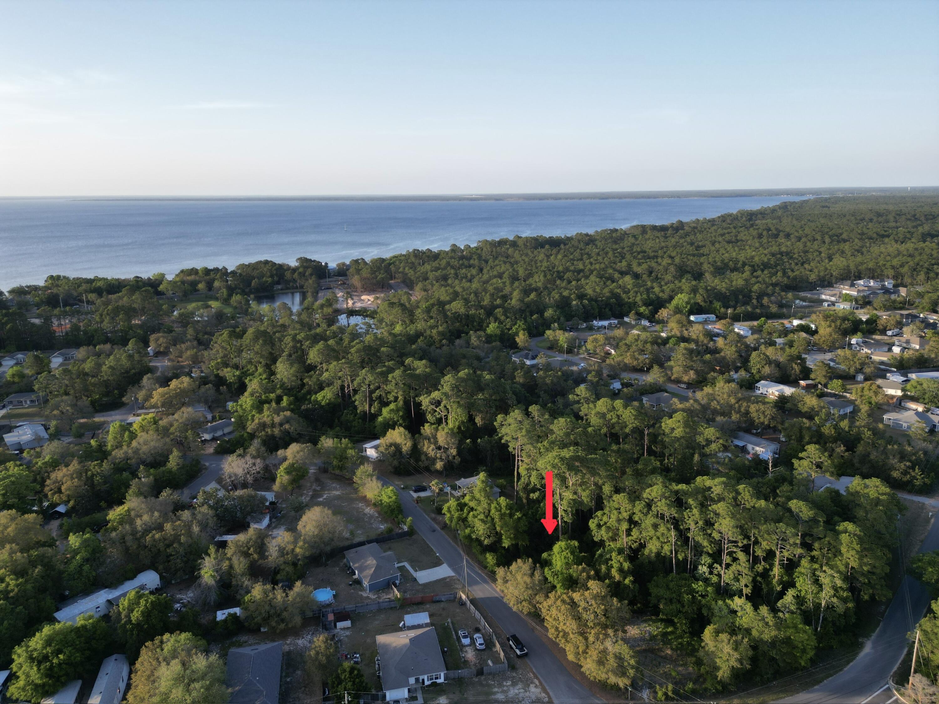 .476 acre wooded interior lot zoned R1M . Not in  flood Zone so NO flood insurance required . Frontage 75 ft See photos for other GIS pertinent information . No studies or survey have been completed. Midway Water , tap fee due. There is a steam on the back side of the property 
 RM1 w allows single family, mobile / manufactured homes, and modular homes. Setbacks are 25' front 10% lot width, 25' rear.
NO RV'S