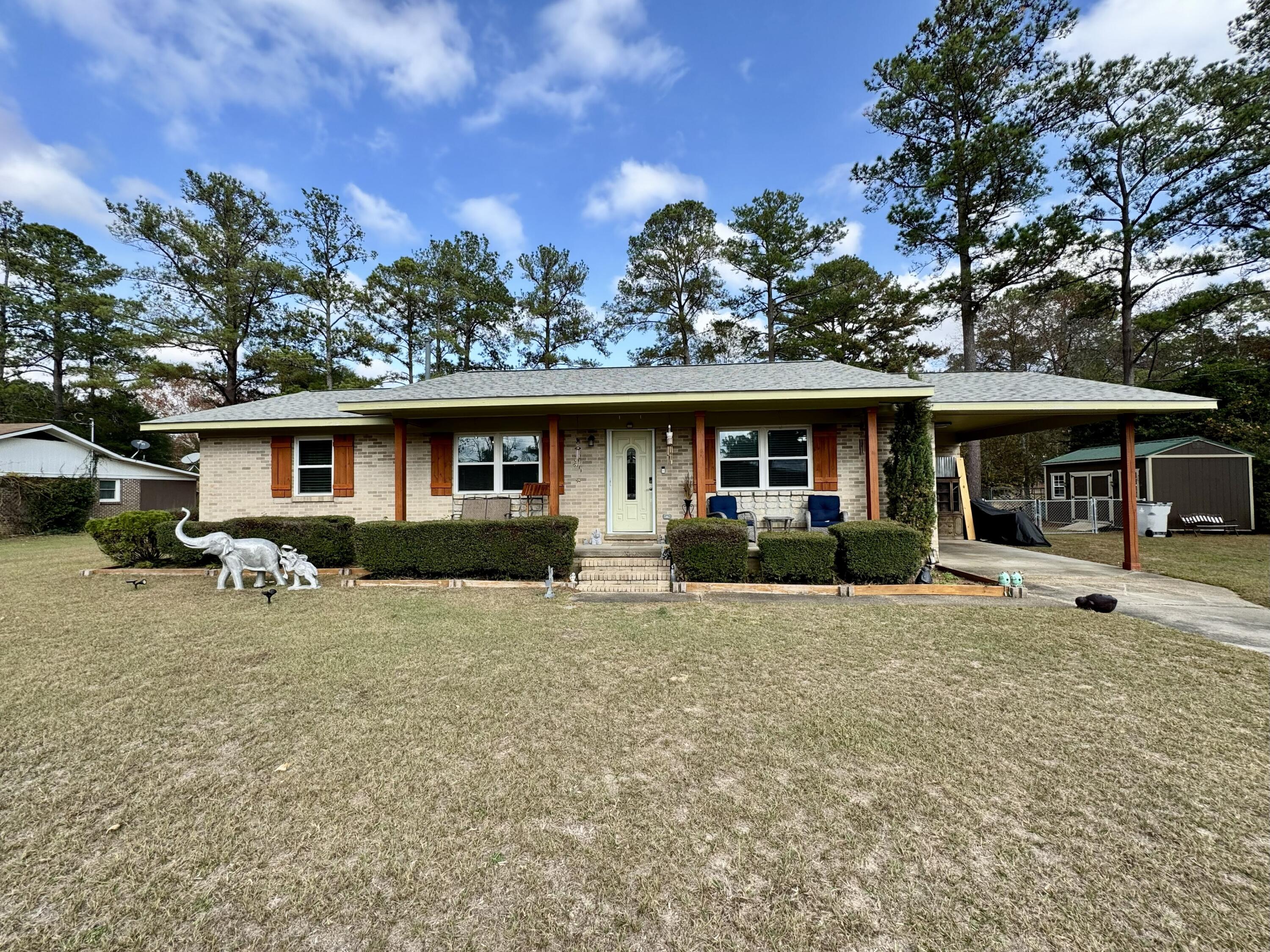 Updated 3BR/2BA brick home in Brookdale on .68 acres! Features include an attached carport, LVP flooring throughout, remodeled baths, retractable screen doors, and enclosed patio area added in 2024. Outdoor amenities include a 16x32 chlorine above-ground pool with deck (2024), fire pit area (2025), small fenced area (2023), storage shed with electricity (2024), and additional shed with exterior water faucet. Major updates include new roof and water heater (2023), new HVAC system (2025), new stovetop (2024), and new exterior light fixtures and electrical outlets (2024). Lots of extras! Move-in ready with modern upgrades inside and out!