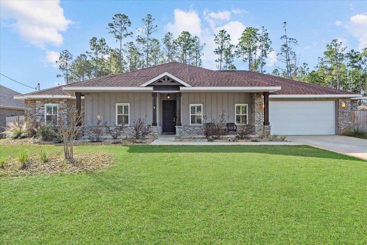 Seller would consider doing a VA Assumable Mortgage if new buyer has their own VA Entitlement. Their current rate is 3.875%. Spacious 4 bedroom home, 2 bath residence featuring a desirable split floor plan & 2 car garage, perfectly designed for comfort and privacy. The open concept layout showcases granite countertops, stainless steel appliances, all wood cabinetry, and a pantry, plantation shutters on all the windows & luxury vinyl plank flooring throughout, no carpet anywhere for easy maintenance. The primary suite offers a relaxing retreat with an extra large walk-in closet. The 3 additional bedrooms are generally sized. All bedroom closets & pantry offer upgraded wooden shelves for that custom look. Enjoy outdoor living with both a large covered front porch and a covered back porch, ideal for morning coffee. Take a look at the 3D Tour and Video. 2 blueberry bushes produce. Backyard is fenced in with woods behind the fence. Located in Holley By The Sea HOA community, residents enjoy exceptional amenities including a recreation center, tennis courts, fully equipped gym, basketball court, swimming pool, sauna, and a scenic waterfront park, along with many additional features for an active and social lifestyle. This home combines space, style, and resort-style living - an excellent opportunity you won't want to miss. Please have Preapproval letter before viewing.