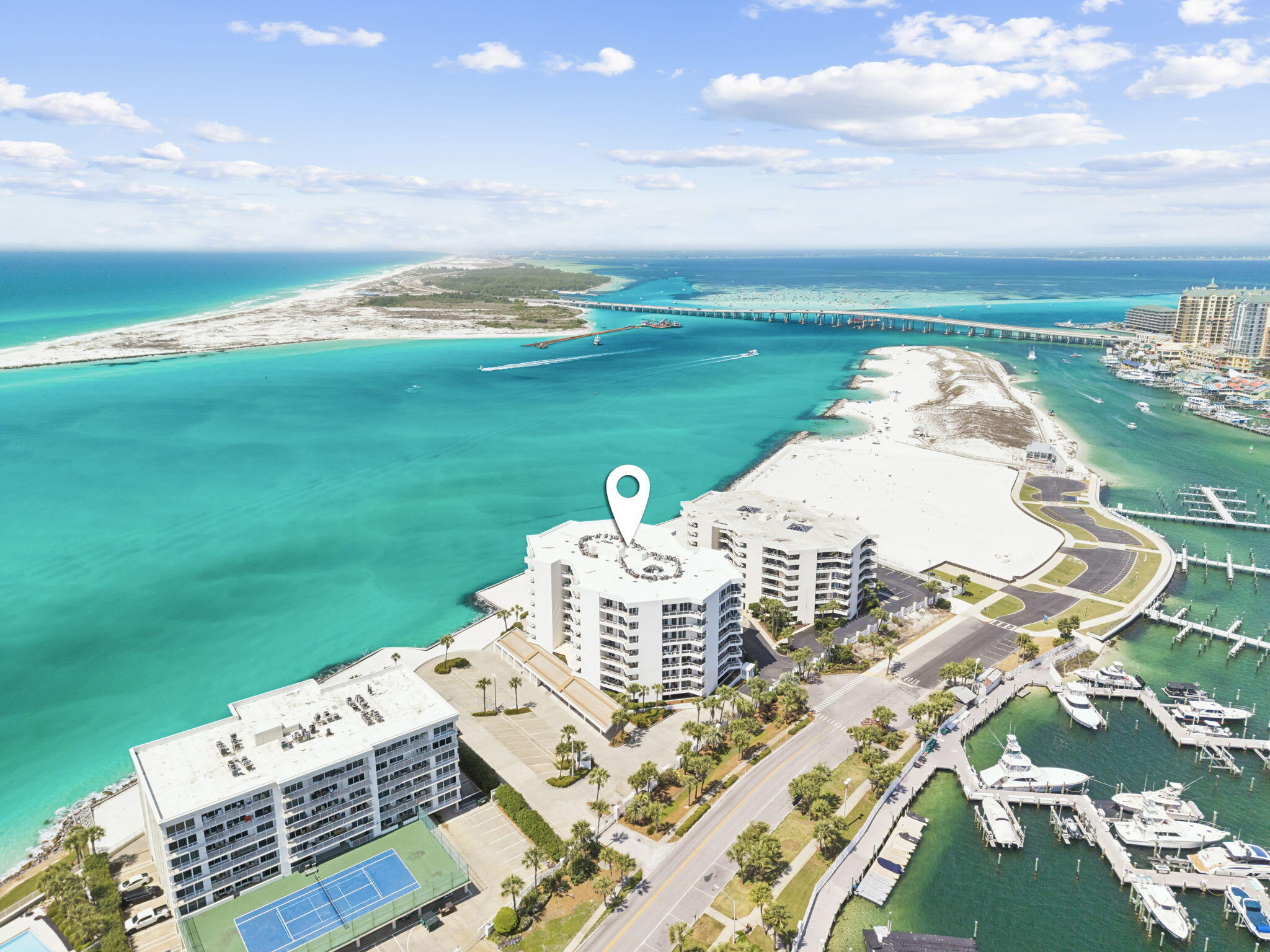 Boat Slip available for separate purchase - A Rare Opportunity to Own the Complete Destin Waterfront Lifestyle.
Experience refined coastal living at East Pass Towers, where luxury meets effortless boating convenience. This beautifully renovated 4th-floor residence offers captivating views of Destin Harbor and the East Pass, setting the stage for days that begin and end on the water.

Inside, walls of floor-to-ceiling glass flood the space with natural light and frame the coastal backdrop, while a spacious private balcony invites morning coffee and sunset unwinding with harbor activity below. The open-concept design flows seamlessly through the living, dining, and kitchen areas--featuring modern cabinetry, a large island, and custom pantry-ideal for relaxation and entertaining. Two generous bedrooms and updated baths offer comfort and privacy, while thoughtful renovations throughout create a polished, move-in-ready residence.

What truly sets this offering apart is the ability to purchase a boat slip in conjunction with the condo--an increasingly rare advantage in Destin--placing effortless access to the Gulf right at your doorstep. Launch for a day of fishing, cruising, or waterfront dining within minutes.

East Pass Towers has recently completed significant upgrades, with SIRS complete and all assessments paid, delivering both confidence and long-term value. This gated, rental-restricted community (3-month minimum) ensures a quieter, more private residential experience.

Amenities include a private beach area, seasonally heated pool and spa, fitness center with sauna, owner's club room, covered parking, and dedicated storage. Just across the street, the marina and water taxi provide seamless access to the harbor's premier dining and entertainment.  Only 5 minutes to Gulf of Mexico with no bridge clearance.  East Pass Towers Marina is designated as a "Clean Marina" by the Florida Department of Environmental Protection. Facilities include pump out connections at slip side, 50-amp electrical service in a secure, gated environment. Adjacent to Norriego Point Park...Destin's newest public beachfront park.

This is more than a condo--it's a turnkey waterfront lifestyle, where luxury living and boating come together in one of Destin's most exclusive settings.