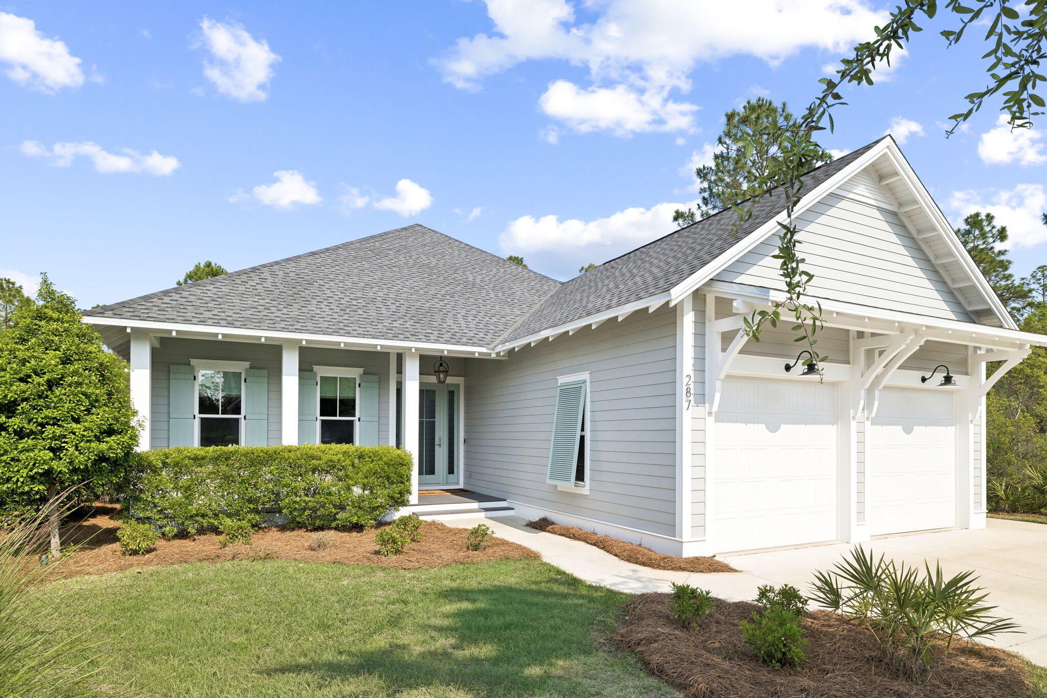 Located in WaterSound Origins, this Ficus plan built by Huff Homes, offers single-level living with over 2,500 square feet, four bedrooms, and a two-car garage, along with a series of thoughtful upgrades throughout.

The backyard is a standout feature, offering an oversized footprint with added privacy and mature, layered landscaping. Room for a pool and spa. Outdoor elements include a gas firepit, coquina shell gas fireplace, and a second set of porch doors that expand access from the main living area, creating multiple points of entry and a more connected layout.

Inside, the home features floor-to-ceiling shiplap in the living room, with additional shiplap detailing in the entry and primary bedroom. Ten-foot ceilings, crown molding, and Kingsley Medallion hardwood flooring run throughout, along with a 42-inch vented gas fireplace in the main living area.

The kitchen is equipped with stacked glass cabinetry with accent lighting, undercabinet lighting, a 36-inch Wolf range, and a 36-inch Sub-Zero built-in refrigerator.

Additional features include a gas lantern at the front porch, a stub for a gas grill with poured pad, security camera outlets, and an outdoor shower located adjacent to the garage, along with added exterior access at the garage for convenience.

A well-maintained home with a functional layout, elevated finishes, and a rare backyard setting within WaterSound Origins.