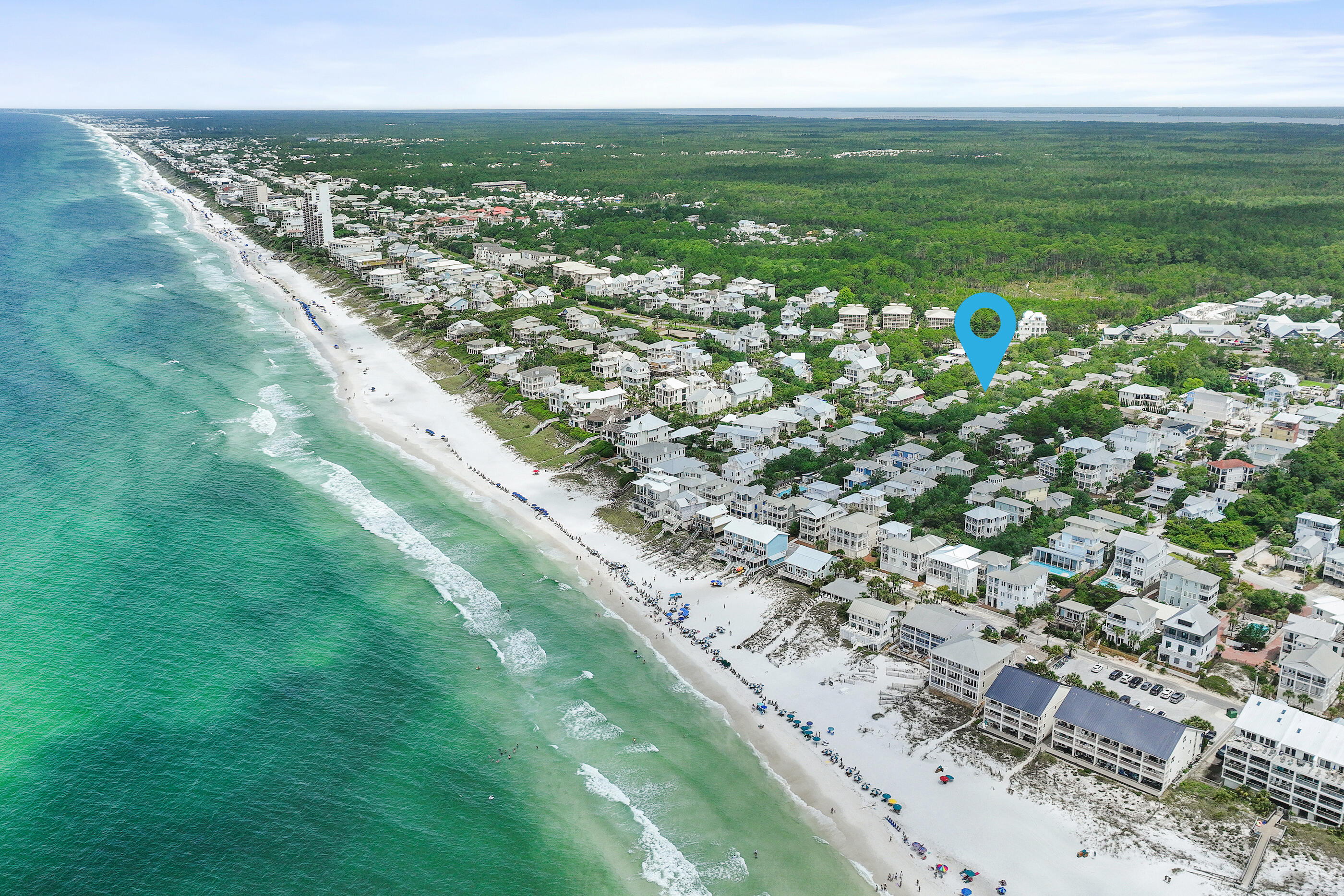 A rare oversized homesite south of 30A, spanning nearly .22 acres, just steps from the beach, Eastern Lake, scenic natural trails, and the 30A bike path provides the perfect setting for this tastefully renovated coastal retreat in the heart of Seagrove Beach. With no HOA restrictions, the property presents a rare opportunity for true flexibility and expansion. There is ample room to add a luxury resort-style pool, a carriage house, expansive outdoor living spaces, and potential for future vertical development, making it an ideal canvas for a custom 30A beach compound. Tucked beneath a canopy of mature trees on quiet, private street with no through traffic, the setting feels peaceful and secluded while remaining moments from Seaside, Greenway Station, shopping, dining, coffee shops, and local favorites along 30A.The oversized great room flows seamlessly to a screened porch overlooking 50 feet of natural wooded backdrop, extending the living space into a tranquil outdoor setting. The versatile floor plan includes four bedrooms plus a dedicated office that can easily function as a fifth bedroom, making the home well-suited for full-time living, a second home, or a strong investment opportunity. Combining an oversized homesite, ample privacy, walkability, exceptional long-term development potential, this prime location captures the very best of Emerald Coast living in one of Seagrove Beach's most sought-after settings.