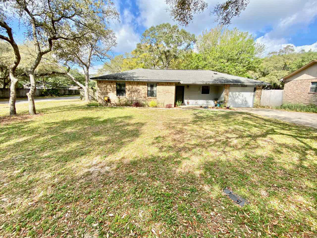 Nice home on a large corner lot in Niceville. Large living room with a cathedral ceiling and fireplace. Separate dining area off the living room and the kitchen. Kitchen has newer appliances - Gas Stove 2014, Fridge 2017, Dishwasher 2019. Outside you can enjoy a large fully fenced backyard with a pavered walkway and fire pit, perfect for entertaining. Fence was installed in 2016, paver's and fire pit installed in 2019, and a new shed in 2019. Oversized 1 car garage.