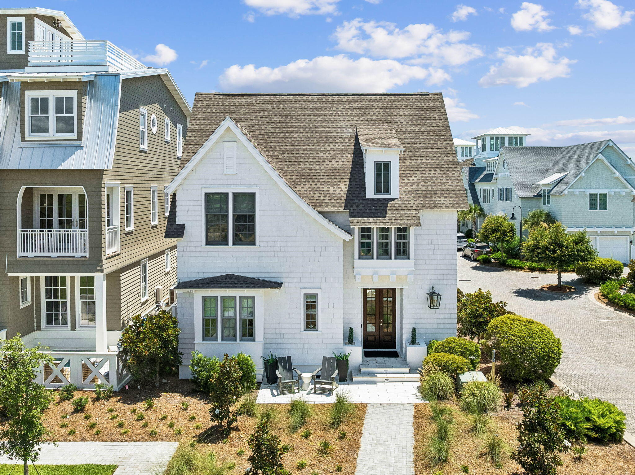 Rarely does a home become available that offers this level of exclusivity, luxury, and location along Scenic Highway 30A. Located within the private gated community of Grace Point and just steps from the Watersound Beach Club, this designer-furnished 4-bedroom, 4.5-bath residence with a 2-car garage presents the opportunity to own the only home of its floor plan and design within the community. Offering 3,456 square feet of thoughtfully custom designed indoor and outdoor living and entertaining space, including 2,582 square feet of heated and cooled living area, the home showcases exceptional architectural detail with custom millwork, shiplap walls, hardwood flooring, premium Wolf appliances, curated furnishings, designer lighting, Wi-Fi thermostats, remote-controlled blinds, and an outdoor entertaining area featuring a hot tub, fire pit, new Wolf outdoor grill, and an existing permit to add a private pool. Sold fully furnished and meticulously cared for with minimal owner usage, this exceptional residence nestled just south of 30A represents a truly one-of-a-kind offering in Grace Point. The open-concept living, dining, and kitchen spaces serve as the heart of the home, creating an inviting atmosphere for everyday living and effortless entertaining. The well-appointed kitchen features premium Wolf appliances, an oversized island, quartz countertops, shaker-style cabinetry, a classic subway tile backsplash, and generous storage, while the adjoining living area opens to the outdoor patio, where evenings are spent gathered around the fire pit, unwinding in the hot tub, or enjoying dinner from the new Wolf outdoor grill. A private first-floor guest suite with an ensuite bath offers added flexibility, while the second level is home to a beautifully appointed primary retreat complete with a morning coffee bar, spa-inspired bath, and spacious walk-in closet, along with two additional ensuite bedrooms, one featuring its own private balcony. Dual laundry rooms on both levels further enhance the home's everyday comfort and convenience. 

Grace Point is one of 30A's most sought-after gated communities, offering a private coastal setting with beautifully designed homes, peaceful surroundings, and an unmatched location directly along Scenic Highway 30A. Just steps from the Watersound Beach Club and minutes from Camp Creek, state park trails, Rosemary Beach, Alys Beach, Seaside, acclaimed dining, boutique shopping, and the Emerald Coast's renowned sugar-white beaches, the community places the very best of 30A within easy reach. Whether you're searching for a full-time residence or a luxury coastal retreat, 87 Grace Point Way offers a rare opportunity to own an exceptional home in one of 30A's most desirable communities.