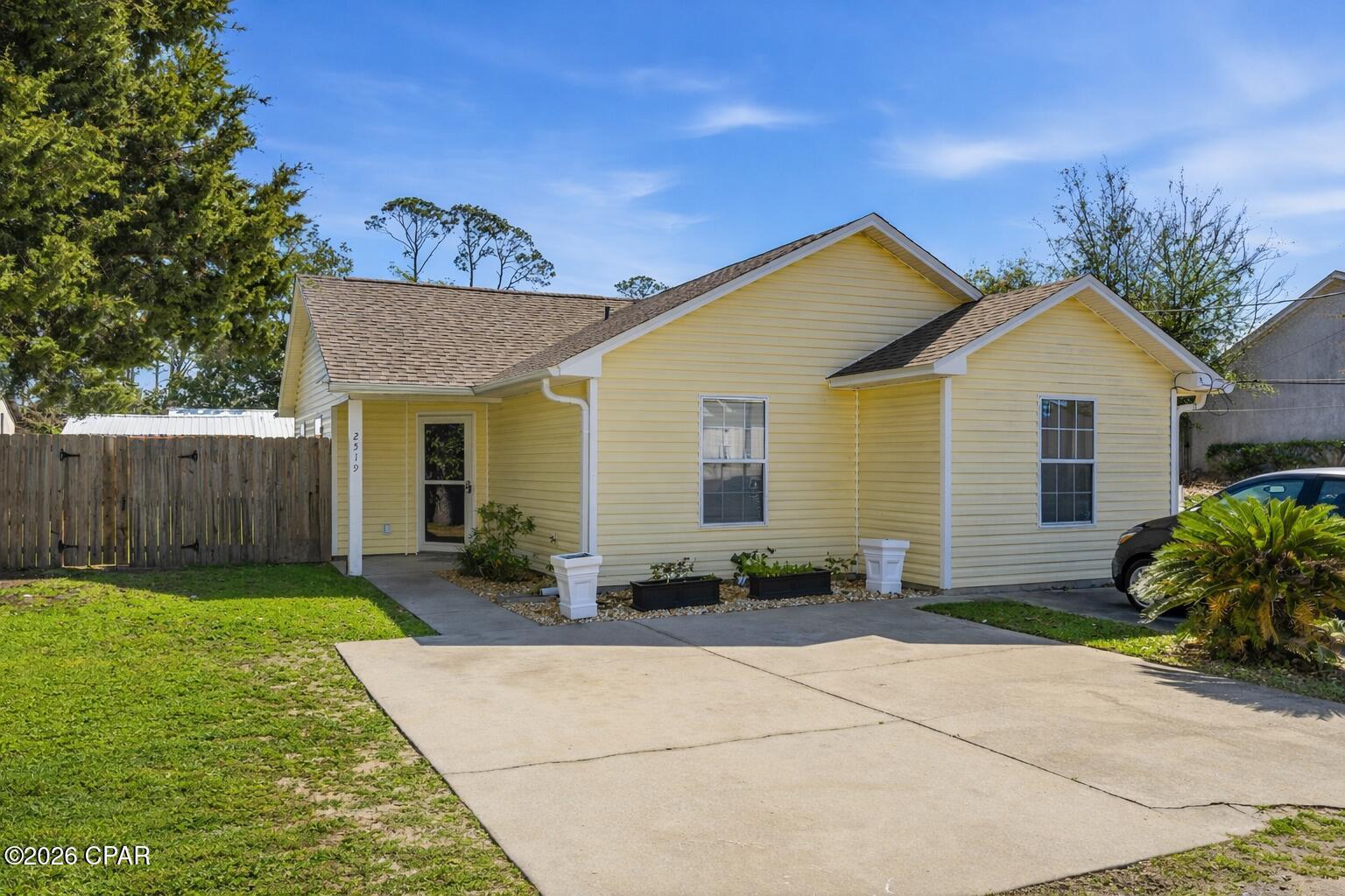 CURRENTLY UNDER CONTRACT, SELLER ACCEPTING BACKUP OFFERS - Enjoy coastal living just one mile from the beach, St. Andrews State Park, and the Navy Base. This inviting property offers a spacious layout with thoughtful updates, making it move-in ready and ideal for full-time living, a second home, or an income-producing opportunity. The interior has been refreshed with a fully updated kitchen in 2026, featuring modern finishes and improved functionality, along with bathroom upgrades completed in 2026 and durable LVP flooring installed throughout. Sunlit living areas create a warm, welcoming feel and provide a comfortable setting for both everyday living and entertaining. Major systems and maintenance items have already been addressed, offering added confidence for the next owner. The roof and water heater were both replaced in 2019, the A/C is approximately 10 years old and was serviced in January 2026, septic extraction was completed in spring 2024 (with an expected 4-6 year cycle), and the sump pump was replaced in 2025 with an upgraded electrical outlet in 2024. Storm doors are less than two years old, adding both convenience and efficiency. Outside, the fenced yard creates a private space for pets, gatherings, or simply enjoying the coastal air. There is plenty of room to customize the outdoor area to fit your lifestyle, whether that's adding a firepit, garden, or additional seating. With no HOA and short-term rentals allowed with proper city and county registration, this property offers flexibility for personal use, seasonal stays, or investment income. Its location places you close to local restaurants, shopping, marinas, and Gulf access, making it easy to enjoy everything Panama City Beach has to offer. Whether you're looking for a primary residence, a beachside getaway, or a property with strong rental potential, this home checks all the boxes.