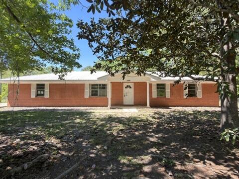This HUD Owned REO home screams country living, affordability, and opportunity. Situated on over 1/2 acre this 3 bedroom 2 and 1/2 bath home feels larger than what is truly there. With all brick exterior, fenced lot, oversized side entry attached garage and a seperate oversized 2 car garage, this home is one to see. Just a few miles from I10 access you can live in the country and work just about anywhere. A definite must see to appreciate. This home does needs some repairs, therefore not all financing is available, but home is FHA IE (insurable with escrow).