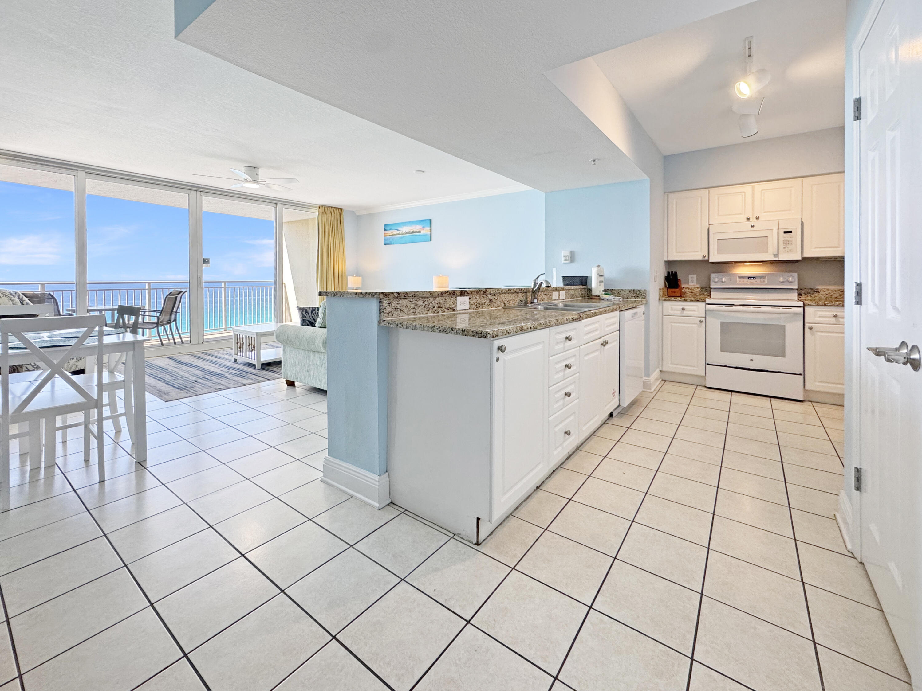 This spacious Gulf-front residence at Emerald Beach Resort offers one of the largest and most desirable 1-bedroom floor plans in Panama City Beach. Designed to maximize both comfort and views, the open living and dining area features a dramatic 12-foot wall of floor-to-ceiling glass, seamlessly connecting to a private balcony where stunning Gulf views become part of your everyday living experience. The well-appointed kitchen includes granite countertops and a convenient breakfast bar, ideal for casual dining or entertaining. This unit comfortably accommodates up to six guests with a spacious primary suite (king bed), a built-in bunk nook, and a queen sleeper sofa. Two full bathrooms provide added convenience for owners and guests alike. Thoughtfully designed for low-maintenance coastal living, the condo features tile flooring throughout the main living areas, an in-unit washer and dryer, and a functional layout that lives larger than expected. Positioned on the 11th floor, enjoy a perfect balance of elevated views and privacy, with high-speed elevator access for ease and convenience. Resort-style amenities include multiple pools (Gulf-front pool, zero-entry splash pool, and seasonally heated options), hot tubs, fitness center with day spa, Sky Bar, grilling areas, on-site dining including Starbucks, gift shop, convention center, and approximately 1,000 feet of private beach frontage. Ideally located just minutes from Pier Park, popular dining spots like Sharky's Beachfront Restaurant, and top attractions including Topgolf Panama City Beach and Pirate's Voyage Dinner & Show, this property offers outstanding potential as a primary residence, second home, or investment opportunity. Property is being sold as part of a bankruptcy proceeding and is subject to court approval. Buyer to verify all details and timelines associated with the sale.