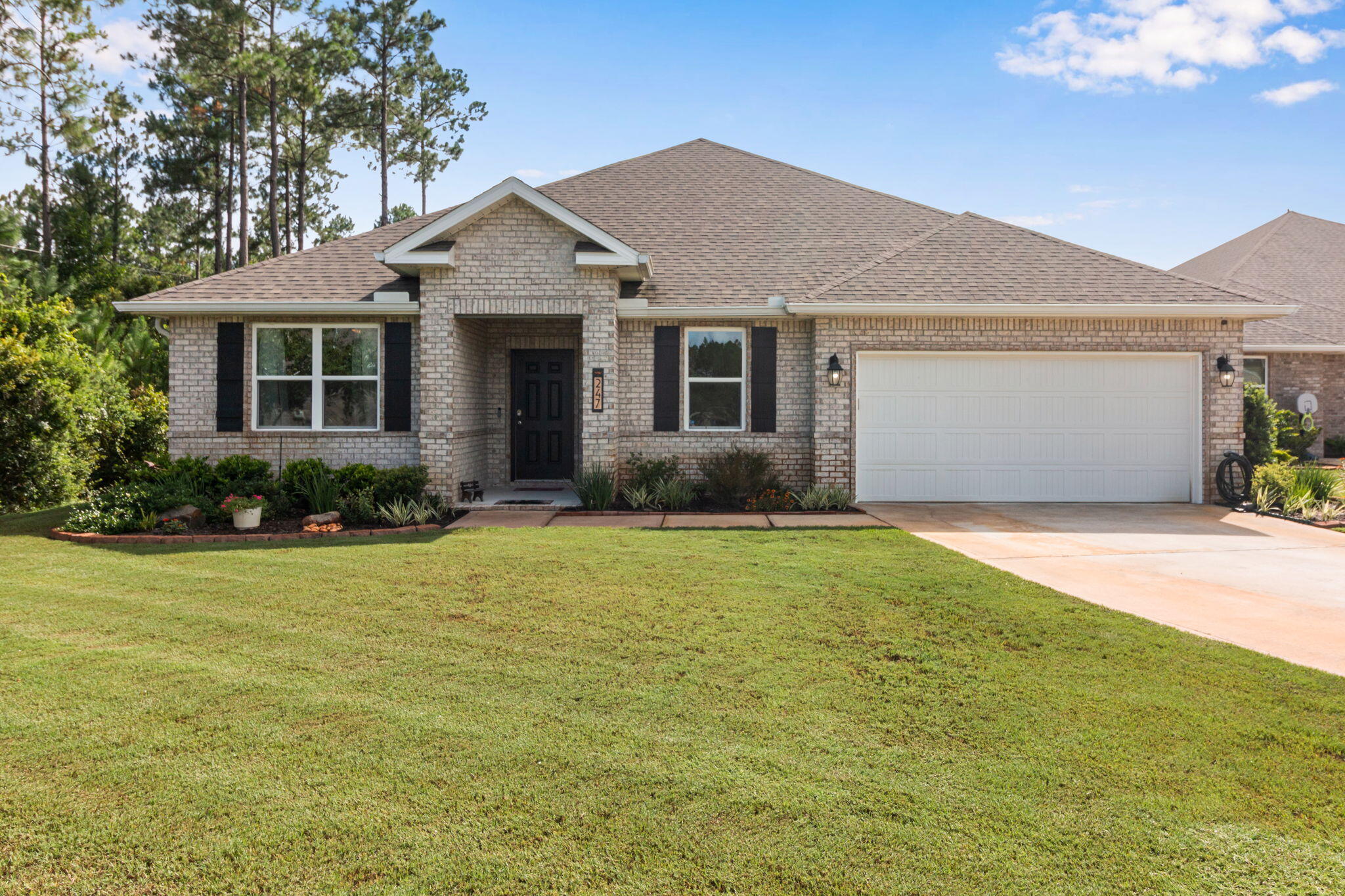 Welcome to this beautifully maintained lakefront home in the highly sought-after Hammock Bay community! Offering 4 bedrooms, 3 full bathrooms, and a versatile craft room that can easily serve as a fifth bedroom, home office, or flex space, this home perfectly blends comfort, style, and functionality.

Designed with an open-concept floor plan, the spacious living, dining, and kitchen areas create an inviting space for entertaining and everyday living. The kitchen features abundant white cabinetry, stainless steel appliances, a large center island with bar seating, generous counter space, and a walk-in pantry. Crown molding, recessed lighting, and luxury vinyl plank flooring throughout the main living areas add timeless appeal.

The private primary suite is a peaceful retreat featuring tray ceilings, dual vanities, a spacious walk-in shower, and an oversized walk-in closet. Three additional guest bedrooms, two full guest bathrooms, and the flexible bonus room provide plenty of space to accommodate family, guests, hobbies, or a growing household.

Enjoy peaceful mornings and relaxing evenings from the screened lanai overlooking the serene lake, offering beautiful water views and a tranquil backdrop. The fully fenced backyard provides plenty of room for pets, play, or simply enjoying the Florida outdoors.

Located in the award-winning Hammock Bay community, residents enjoy exceptional amenities including resort-style pools, fitness centers, tennis and pickleball courts, miles of walking and biking trails, parks, playgrounds, sports fields, bayfront amenities, and a vibrant Town Center featuring dining, entertainment, and year-round community events.

Conveniently located just minutes from the white-sand beaches of Scenic Highway 30A, Choctawhatchee Bay, shopping, dining, and top-rated schools, this home offers the perfect combination of peaceful waterfront living and everyday convenience.

Whether you're looking for a spacious family home, room to grow, or simply a place to enjoy the Florida lifestyle, this exceptional lakefront property is ready to welcome you home.
