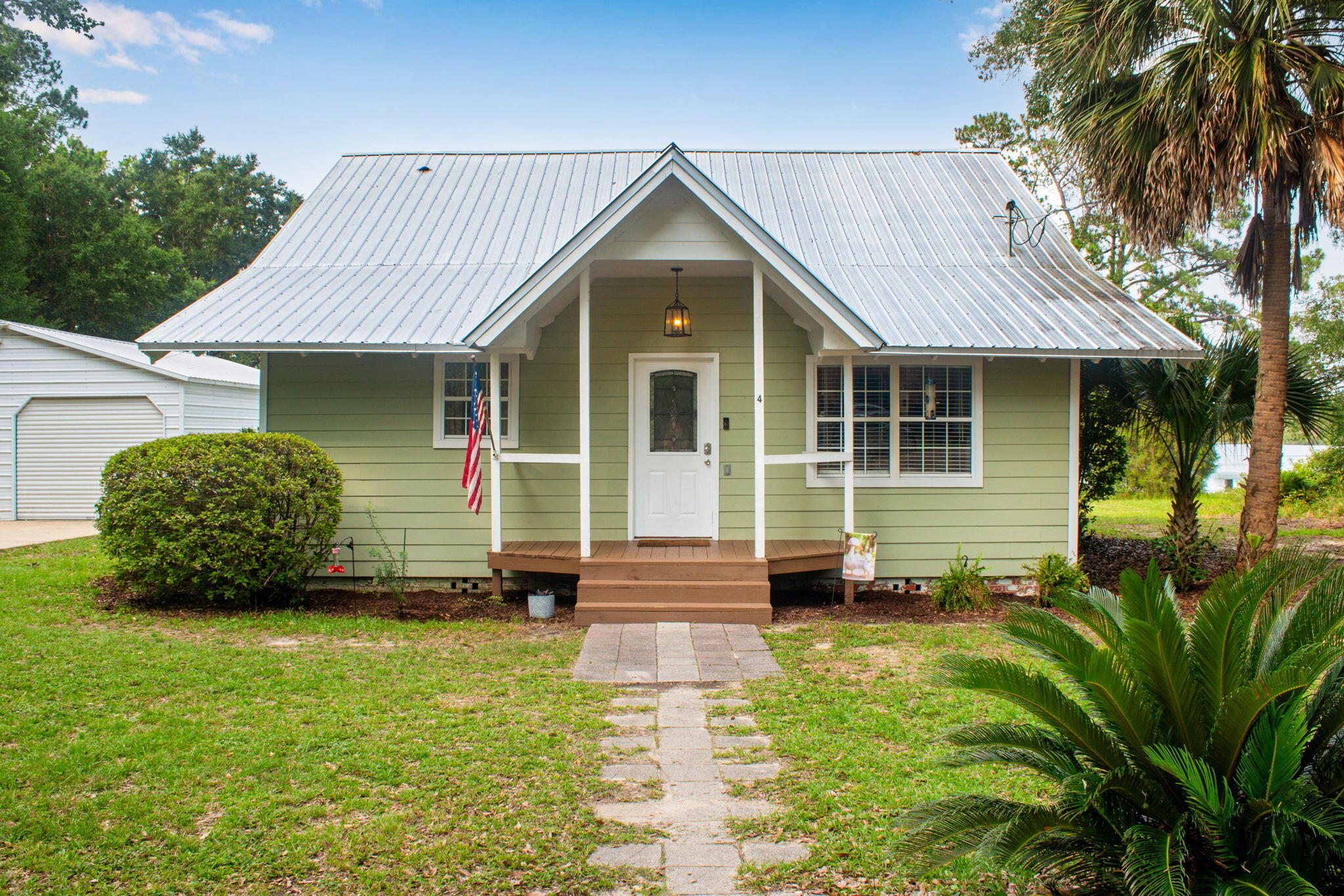 Welcome to your own waterfront retreat on the shores of Lake Stanley, one of DeFuniak Springs' most sought-after spring-fed ski lakes. Surrounded by mature shade trees, this beautifully updated home blends timeless character with modern comforts, offering the perfect setting for full-time living or a weekend getaway.

Inside, you'll find warm hardwood floors, an inviting living room with a cozy fireplace flanked by built-in shelving, and a thoughtfully renovated kitchen featuring butcher block countertops, custom cabinetry, stainless steel appliances, and charming beadboard ceilings. The spacious primary suite offers a peaceful escape with a walk-in closet, barn doors, and an updated en-suite bath, while additional bedrooms provide plenty of room for family and guests.

Step outside to enjoy the expansive multi-level deck overlooking the lake--ideal for grilling, entertaining, or simply relaxing while taking in the peaceful water views. Wander down to your private dock, where endless days of boating, jet skiing, paddleboarding, kayaking, fishing, and swimming await. The gentle shoreline and calm, spring-fed waters create the perfect backdrop for making lifelong memories on the lake. Whether you're watching the sunrise over the water with your morning coffee, spending afternoons on the boat, or enjoying evenings around the fire after a day on the lake, this property offers the waterfront lifestyle you've been dreaming of.

Don't miss your opportunity to own a piece of paradise on Lake Stanley--schedule your private showing today!