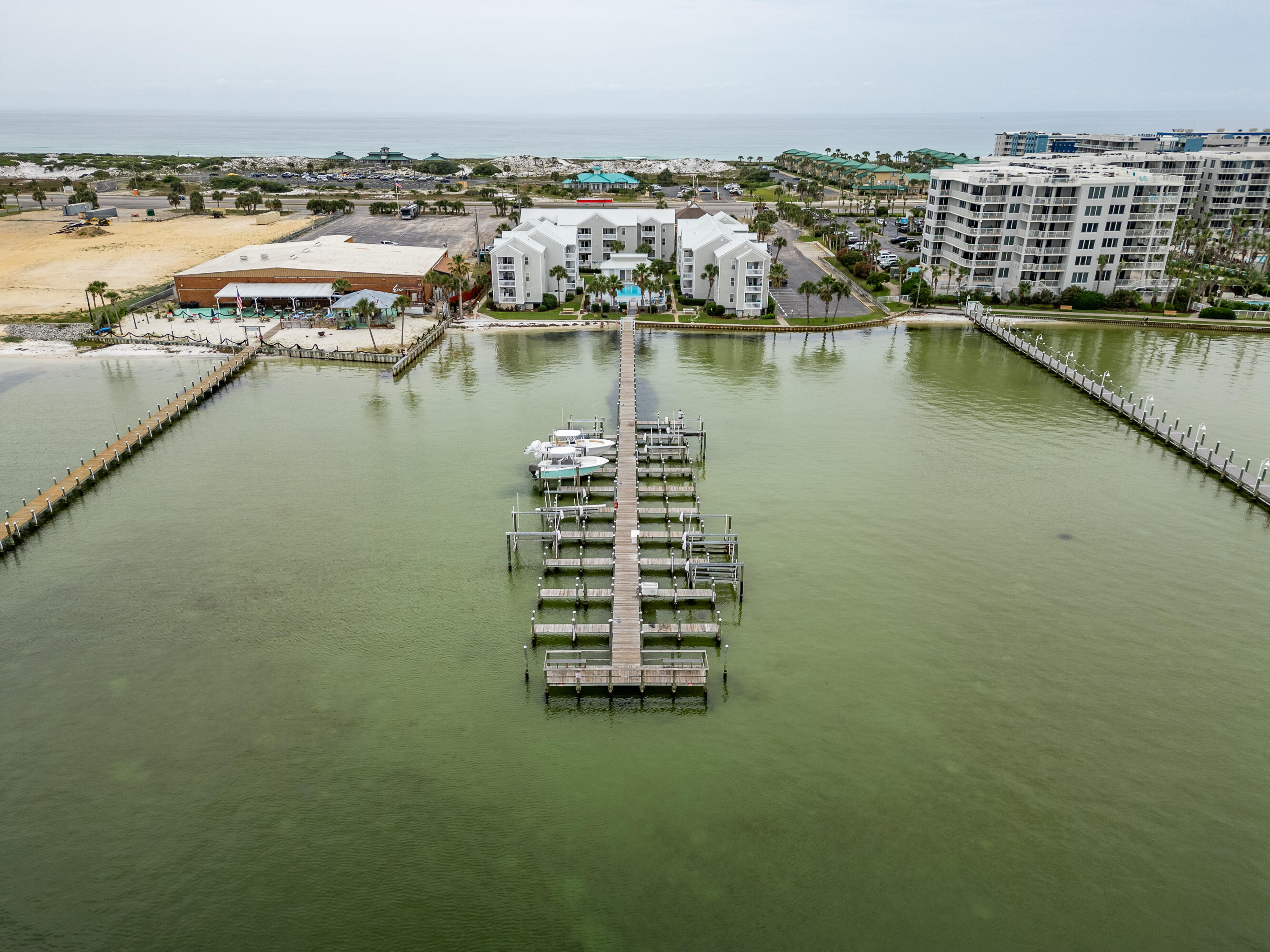 Welcome to your bayside retreat! This beautiful condo offers unbeatable views and breathtaking sunsets right from your balcony and living room. The open floor plan features stylish LVP flooring throughout the main living areas and tile in the bathrooms. Sold fully furnished, this unit is truly move-in--or rental--ready. The kitchen is equipped with matching stainless steel appliances, and the washer and dryer convey for added convenience. Enjoy the community's inground pool overlooking the bay, or take advantage of the short-term rental potential in this highly desirable location. A new water heater (2022) adds peace of mind, and HOA fees cover water, sewer, Cox internet, and landscaping for easy, worry-free ownership. Don't miss your chance to own a turn-key slice of paradise on the bay!