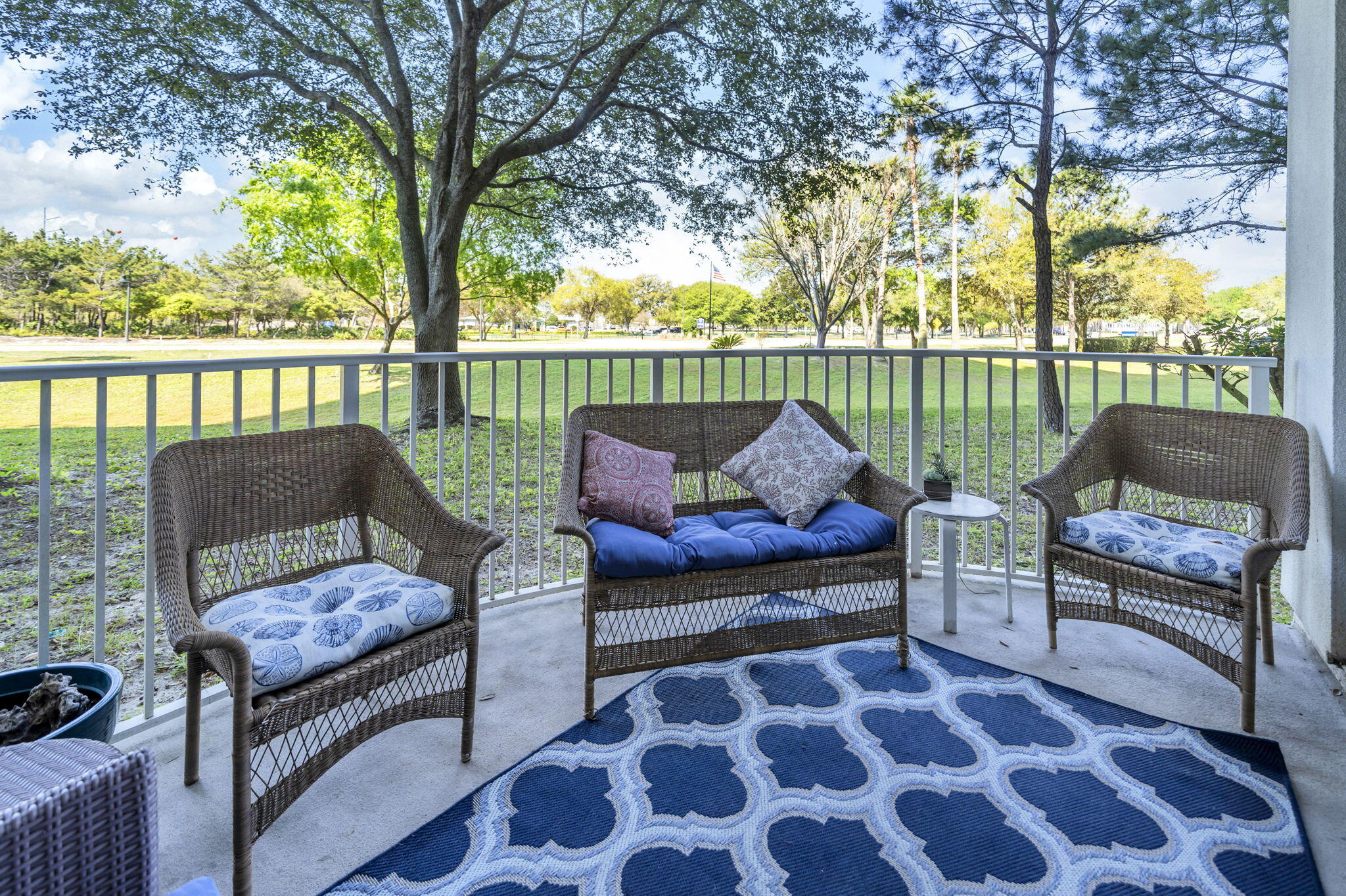 Just steps from the resort-style pool, yet tucked away enough to enjoy a quieter, more private setting, this condo offers the best of both worlds at The Palms of Destin. Located on the first floor, it provides easy access with no elevators, making it especially convenient for families and guests. Featuring high ceilings and floor-to-ceiling glass create a bright, open layout filled with natural light. This 2-bedroom, 2-bath design features a king suite and a second bedroom with a full-size bed, both with private ensuite bathrooms for added comfort and privacy. The spacious patio is perfect for morning coffee or unwinding in the evening with a glass of wine, offering a relaxed coastal feel without the noise of being directly on the pool. Buyer to check all measurements!! Thoughtful updates throughout include LVP flooring, updated appliances, and a newer water heater and HVAC, making this a low-maintenance, move-in or rental-ready opportunity. One of the biggest advantages is that HOA dues cover electricity, water, cable, and high-speed Wi-Fi, making ownership simple and predictable. The unit carries a clean Destin coastal style and works well as a short-term rental, second home, or primary residence. The Palms of Destin is known for its 11,000 sq ft lagoon pool, heated pool, hot tub, splash pad, and kids pool. Additional amenities include a fitness center, tennis courts, pickleball, basketball, grilling area, and on-site dining with coffee shop, tiki bar, and sports lounge. When you're ready for the beach, complimentary shuttle service makes it easy to reach the Gulf in just minutes, while still being centrally located near Destin's top restaurants, shopping, and entertainment. This a turnkey, income-producing opportunity with strong rental potential in one of Destin's most popular resorts. Buyer to verify all dimensions.