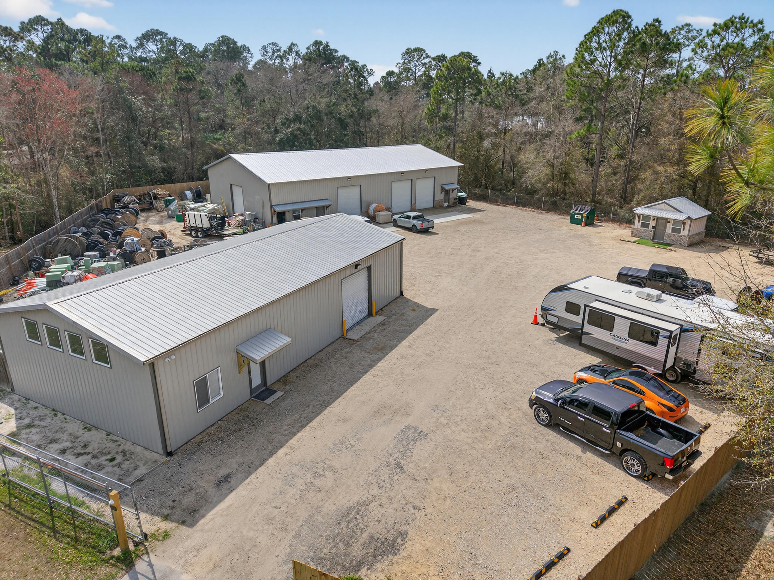 Income producing, potential Barndominiom.  live and operate a business from the same property, this unique opportunity blends residential comfort with income-producing and expansion potential.

The property features a 1 bedroom, 1 bathroom residence (approximately 700 sqft), paired with 1,900 sqft of attached flexible space ideal for operating your own business, creating a workshop, expanding storage, or leasing for additional income.

In addition, there is a 4,500 sqft detached building plus a 300 sqft detached office space, currently generating $6,500 per month in rental income. That existing revenue can significantly offset your mortgage while you leverage the remaining space to build and grow your own operation. Strategically positioned with convenient access to Highway 331, Highway 20, and just a short drive to 30A, this location offers strong connectivity between the beaches, Freeport, and the greater Walton County growth corridor. Easy access to these major routes provides both visibility and convenience, ideal for business operations that benefit from steady traffic flow and proximity to expanding residential and commercial development.

This is a rare opportunity to own a property where you can live, generate income, and scale your business,  all from one strategically located site.

Residential flexibility. Commercial potential. Income already in place.