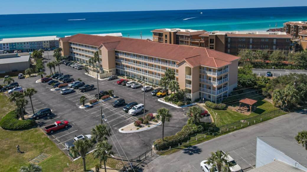 Step into your ultimate coastal getaway in beautiful Miramar Beach, Florida! Located directly across the street from the breathtaking emerald waters of the Gulf of America, this 2-bedroom, 2-bathroom condominium is the perfect blend of relaxation and opportunity. Whether you are looking to expand your portfolio with a lucrative short-term rental or secure a private second home, this property delivers exceptional value.
Getting to your unit is a breeze with convenient elevator access on the property. Once settled, enjoy exclusive private beach access, allowing you to bypass the public crowds and step straight onto the sand. This rare find is also entirely pet-friendly, meaning your furry family members can join in on the coastal living! When you are not at the beach, take advantage of the fantastic low-HOA resort-style amenities. Lounge by the community pool, challenge friends to a match on the tennis or pickleball courts or host an evening cookout at the outdoor pavilion and grill area. Adventure seekers will especially love the ample parking that explicitly accommodates both boats and trailers, a massive premium and highly sought-after feature for Miramar Beach rentals.
Beyond the complex, you are just moments away from top-tier shopping and local restaurants, ensuring that entertainment and dining are always within easy reach. Maximize your ROI in a highly desirable vacation destination.  New HVAC and refrigerator installed in 2026. Schedule your showing today and secure your slice of paradise!