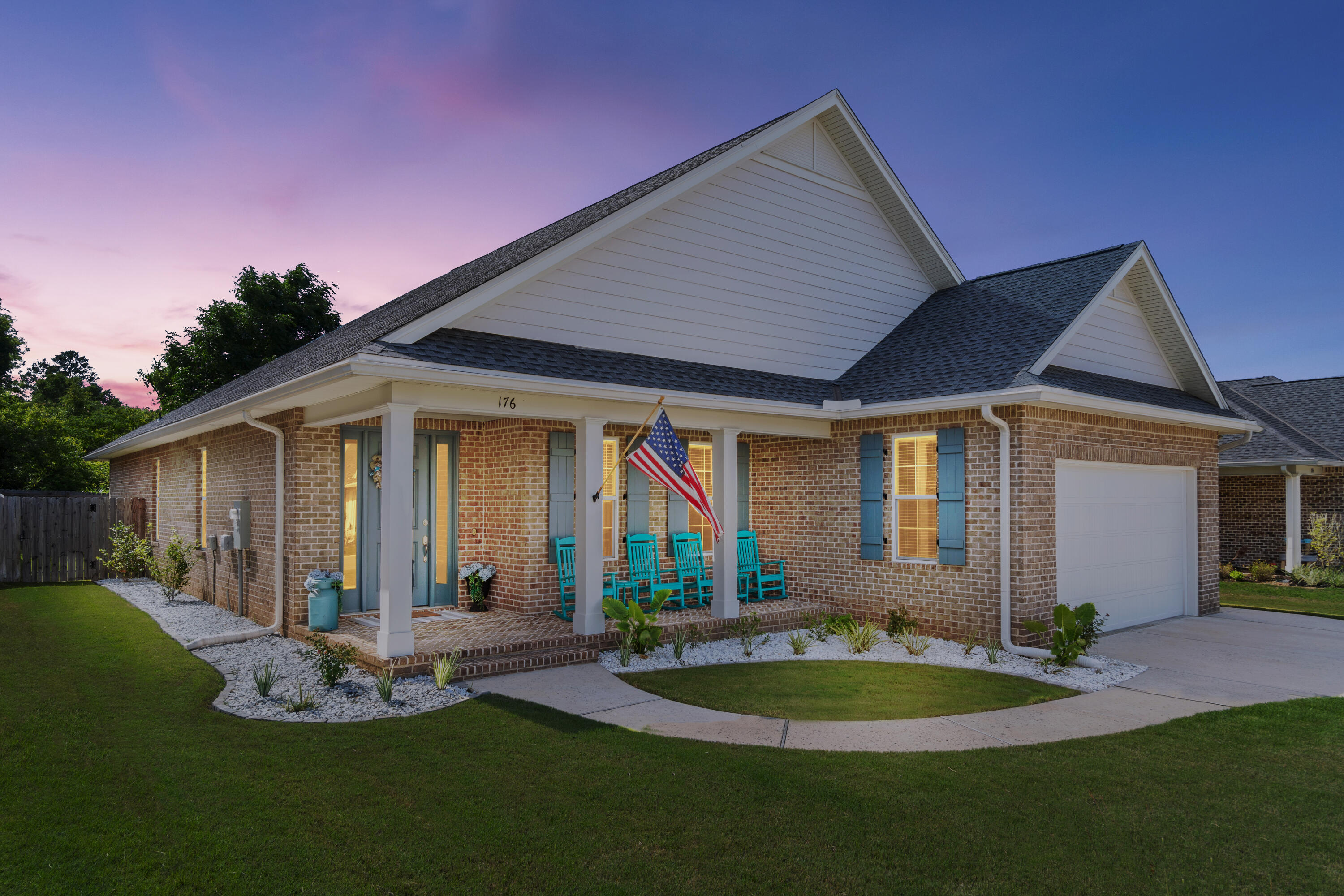 Built with comfort and thoughtful design in mind, this home offers a functional, well-executed flow. A dedicated foyer opens into 10-foot ceilings, crown molding in the main living areas, and an open-concept design that brings in natural light and a bright, welcoming feel. Eight-foot doors and continuous vinyl plank flooring create a clean, cohesive look throughout, with tile in all bathrooms and no carpet anywhere.

At the center of the home, the kitchen is designed for both daily use and entertaining. An oversized island anchors the space, complemented by quartz countertops, soft-close cabinetry, and premium Bosch stainless steel appliances. Hardwired under-cabinet lighting and a dedicated dry bar with coffee station add charm and practical detail.

A three-wing split floor plan offers separation without sacrificing connection. The primary suite is privately situated on its own side, while a second en suite is positioned on the opposite wing. Two additional bedrooms are set apart on their own. Every bedroom has a walk-in closet and ceiling fan.

Upgrades include impact-rated windows, premium black hardware, outdoor gas line for grilling, full laundry room with sink, tankless gas water heater, and exterior eave outlets for added convenience. French doors open to a screened-in porch, extending the living space outdoors. The fully fenced backyard, complete with irrigation and mature landscaping, includes double gate access on both sides of the home. An oversized front porch adds to the home's curb appeal.

Exterior construction is durable and low-maintenance, with a brick exterior complemented by Hardie board accents. The finished and painted garage floor adds a clean, polished look to the oversized two-car garage.

Located in an established residential neighborhood zoned to Niceville High School and convenient to multiple military installations and local amenities. Thoughtfully designed and worth a closer look. Video tour available upon request.