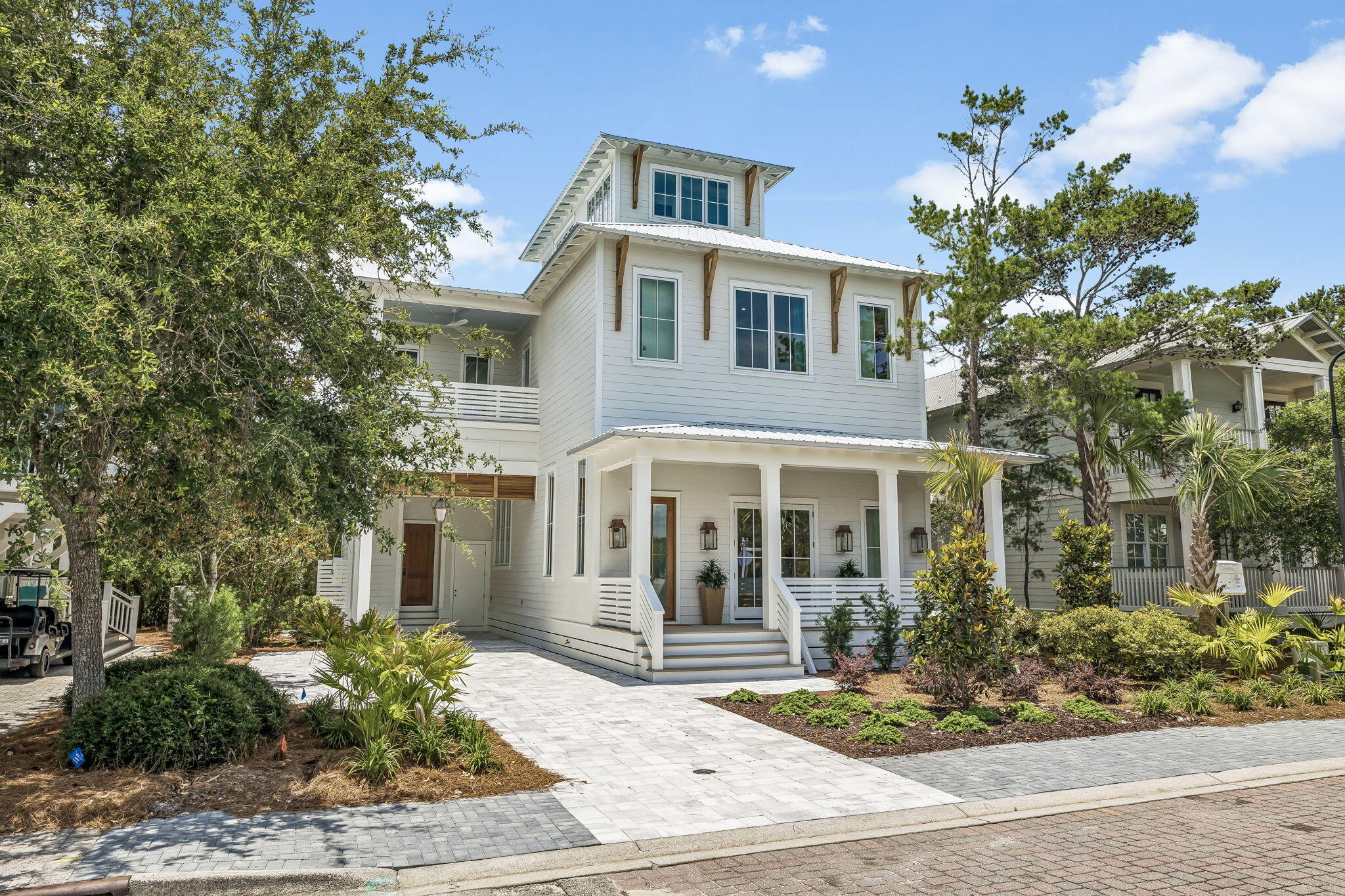 Welcome to the private, gated community of The Preserve at Grayton Beach. Perfectly situated just moments from Seaside and Gulf Place, this neighborhood offers an exceptional lifestyle. This stunning 3,478 sq ft residence, newly constructed by Simmons Custom Homes, is designed for both comfort and elegance. From the inviting rocking chair front porch to the screened-in back porch with its own fireplace and the third floor entertaining area, every space is crafted for enjoyment. This charming Florida Coastal home greets you with thoughtful luxury. The foyer flows into a versatile dining area and a spacious family room, which features a retractable glass wall opening seamlessly to the covered porch. Guest room with ensuite bath. The kitchen is a chef's dream, boasting bar seating, two refrigerators, classic marble countertops, and vibrant café curtains. A half bath and a full laundry room with ample cabinet storage and a utility sink completes the main level. The second floor offers a secondary family room, perfect for relaxing or media viewing. The primary suite is a true retreat, featuring a private covered porch, a spa inspired bath, and generous walk in closets. Two additional guest suites, each with custom tile work and built-in bunk beds ensure comfort for all guests, and a dedicated laundry room on this floor adds modern convenience. An elevator provides easy access to the third floor, which is designed for entertaining with a wet bar, half bath and covered porch. Curated furnishings and high end finishes throughout the home, such as warm wood flooring, cozy brick fireplaces, lighted shelving, rustic brick accents, wood planked ceilings, under the stair wine storage and hand wrought iron railings define the property's unique character. Residents of The Preserve enjoy exclusive amenities including tennis and pickleball courts, two swimming pools, and deeded beach access. Ideally located near the premier shopping and dining destinations of Seaside, Grayton Beach, and Grand Boulevard, this home offers the very best of the 30A lifestyle.
