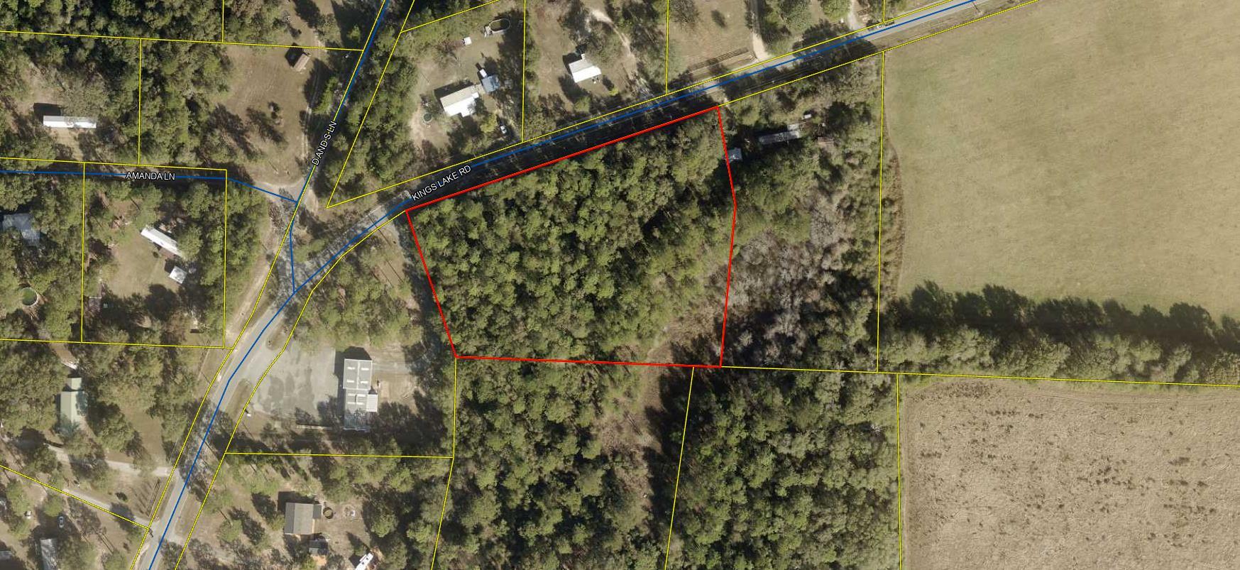 2.71 acres on Kings Lake Road joins the Liberty Fire Station on the west side.  Appx. 489' fee on King Lake Road.  Property is heavily wooded and has city water available (tap fee not paid) and power available on the road. NO HOA, no restrictions.   Build your new home or place your new Manufactured home. The property depth is enough you can place your dwelling and still have privacy.   Survey indicates a seasonal wet water pond on the SE corner of the property. This is a choice property only 5 miles north of DeFuniak Springs.  Survey is under document tab above.
