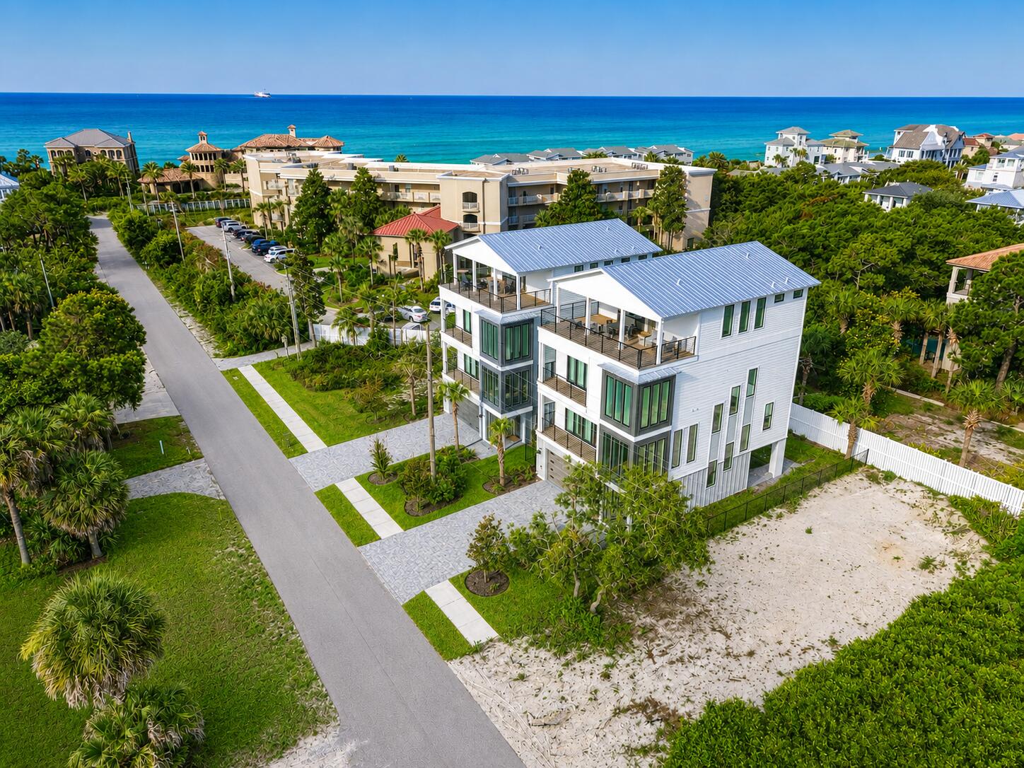 ** $190,000 + in rental income booked for 2026 rental season. ** Brand-new and just finished, this four-story beach retreat sits south of Scenic Highway 30A on Mary Street, less than a 5-minute walk to the white sand beaches and emerald green waters of Blue Mountain Beach, Fla. Designed as a true rental powerhouse with projections around $235,000, this 5BR/5BA+2 half bath home is built for fun, comfort, and income. The first level lives like a poolside cabana, with a mini kitchen, half bath, and a full wall of sliders that open straight out to the private pool and sun deck--perfect for entertaining. Upstairs, the main living floor offers a large open kitchen, dining, and living area with Thermador appliances, a gas range, a sweeping island, and a walk-in pantry, ideal for big groups to gather. The whole second floor is dedicated to this open