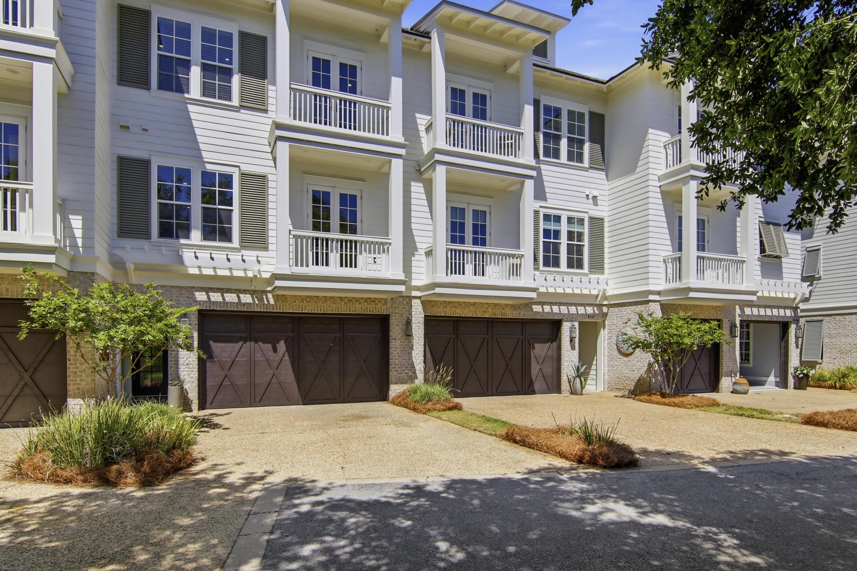 This stunning 4-bedroom, 3.5-bath townhome located within Kelly Plantation, in the Brownstone section, overlooks the Bay, a serene Nature Preserve, and the 3rd hole of the Kelly Plantation Golf Course. Offering just under 2,900 square feet of thoughtfully designed living space, this home combines coastal elegance with modern functionality in one of Destin's most prestigious gated communities. The residence features an elevator, a two-car garage with space for a golf cart, and numerous upgrades including a custom master closet, two balconies on the second and third levels, and brick pavers in the fenced backyard. Perfectly designed for everyday living and entertaining, the expansive second-floor kitchen and living area boast a Wolf gas range, Subzero refrigerator, Bosch dishwasher, and abundant custom cabinetry, creating a space that is as functional as it is beautiful.

The open-concept interior is bathed in natural light, with soaring ceilings, wide-plank hardwood floors, and a serene, airy palette. The main living area centers around a fireplace adorned with shiplap detailing and a custom wood mantle, flowing effortlessly to the second-level balcony where breathtaking views and a peaceful atmosphere provide the perfect retreat.

Upstairs, the primary suite is a luxurious sanctuary with a spa-inspired ensuite featuring a soaking tub, walk-in shower, dual vanities, and a generously sized walk-in closet. The third-level balcony extends the living space outdoors, providing an additional private retreat with serene views. Three additional bedrooms and two full baths offer comfortable accommodations, while a versatile bonus room provides endless possibilities for a media room, office, or fitness space.

Outdoor living is enhanced by a fenced backyard, ideal for children or pets, paired with low-maintenance landscaping for a lock-and-leave lifestyle. Additional highlights include a well-appointed laundry room and abundant storage throughout.

Residents of Kelly Plantation enjoy world-class amenities, including a championship golf course, scenic walking trails, pickleball, five clay tennis courts with LED lighting, a bayfront boardwalk, resort-style pool, fitness center, and clubhouse.

This exceptional home presents a rare opportunity to own a move-in-ready residence that seamlessly blends elevated coastal living, sophisticated design, and unparalleled convenience in one of Destin's most coveted communities.
