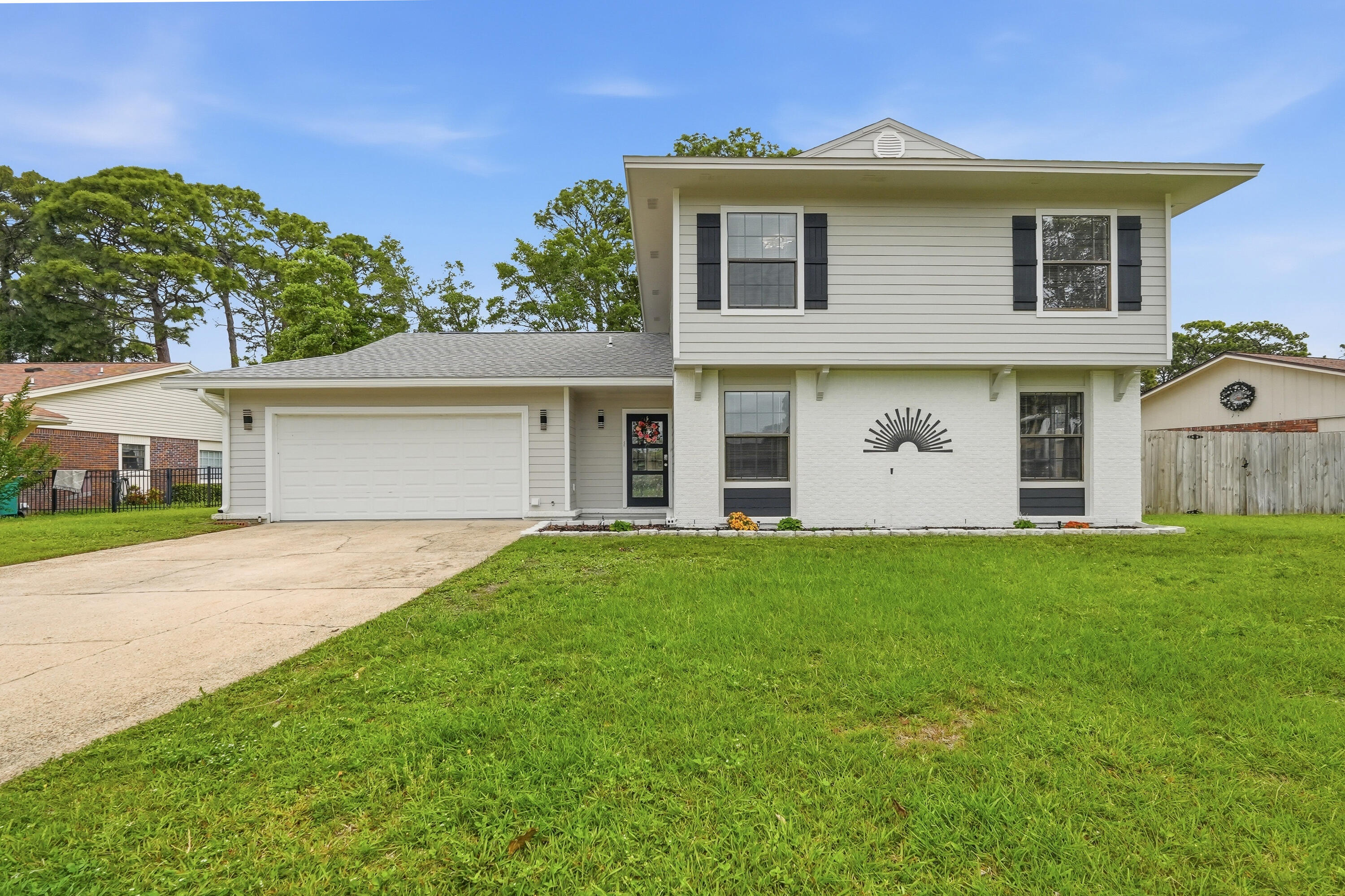 Completely renovated in 2025 and loaded with updates, this golf course home truly checks all the boxes. Major improvements include a 2025 roof, exterior composite concrete siding with fresh paint, interior LVP flooring, fresh interior paint, 2025 water heaters, 2019 HVAC, copper wiring, and an effective year built of 2020.

The kitchen has been completely redone and is packed with high-end features, including a 48-inch KitchenAid refrigerator with ice and water, built-in microwave/oven combo, and a freestanding oven with convection and air fry capabilities. Quartz countertops, custom cabinetry with built-in spice racks, an integrated all-in-one prep appliance, and a butcher block island give the space both style and functionality. This home offers plenty of room to spread out with two living areas, a formal dining room, eat-in kitchen, and an indoor wet bar. Tucked away at the back of the home, the downstairs primary suite feels like its own private retreat with a spa-like bathroom featuring an oversized shower with dual showerhead combinations, a soaking tub, and a large custom closet with functional built-ins. Upstairs, you'll find three additional bedrooms and a full bathroom.

Out back, enjoy the screened-in patio overlooking the golf course; the perfect spot to relax or entertain. Conveniently located just minutes from beaches, bases, schools, and shopping, this home offers the updates, space, and location buyers are looking for.