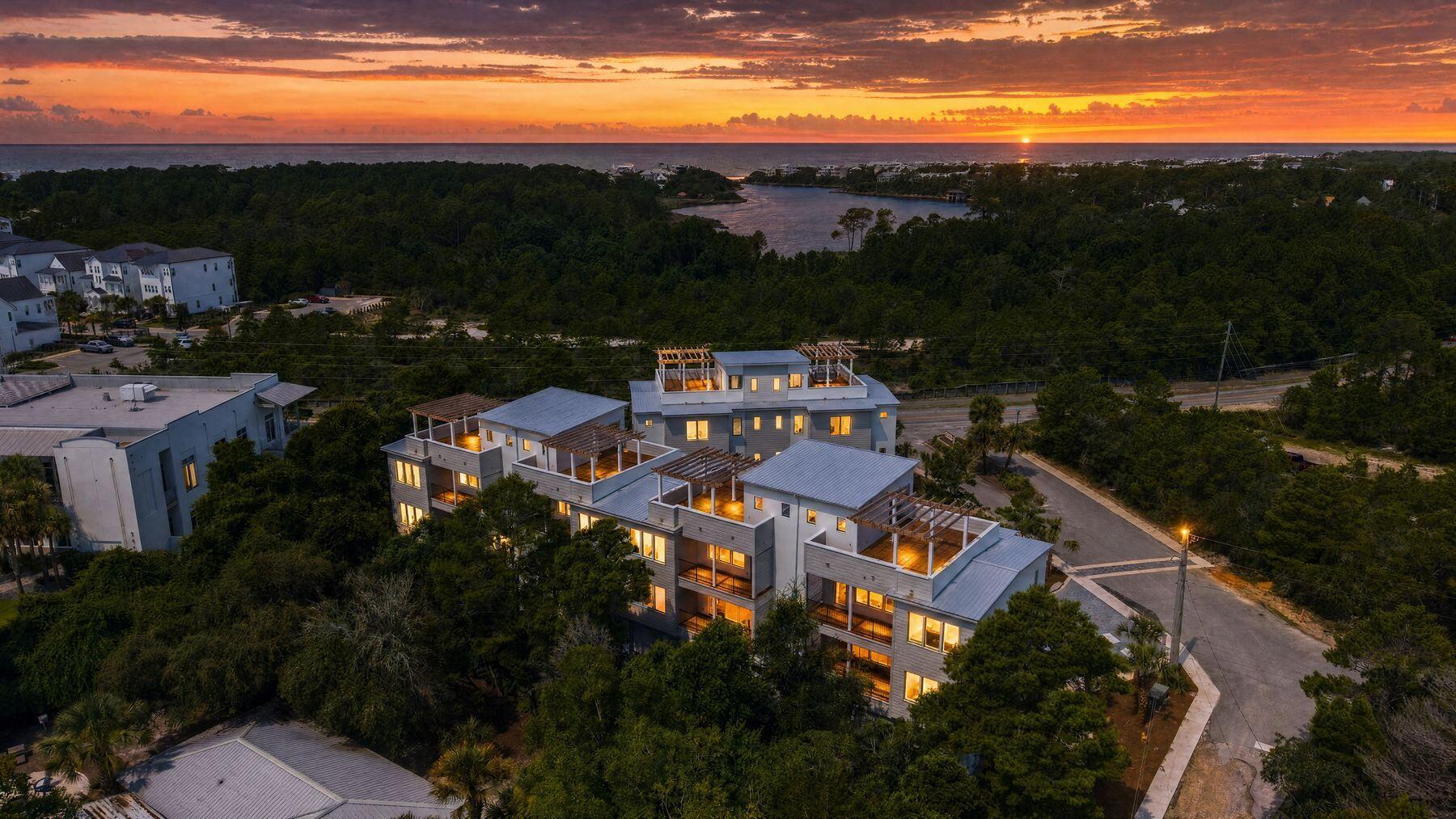 Just completed! Blu Wave at Blue Mountain Beach is an exclusive boutique development featuring just six luxurious townhomes, perfectly positioned to capture sweeping views of Draper Lake and the Gulf. Each residence offers an impressive 2,848 square feet of heated and cooled living space, complemented by expansive outdoor living areas designed for effortless coastal living.
The crown jewel is a remarkable expansive rooftop terrace complete with a wood pergola--ideal for installing a hot tub, outdoor kitchen for hosting unforgettable gatherings, or simply savoring breathtaking sunsets. Multiple balconies extend from the open living area and the third-floor primary suite, creating seamless indoor-outdoor flow and panoramic vistas from every level.
Inside, the thoughtfully designed interior shines with a second-floor open-concept layout that seamlessly integrates the kitchen, dining, and living spaces. The gourmet kitchen is outfitted with premium Thermador appliances, offering top-tier performance and style for both everyday enjoyment and elevated entertaining.
The home features three spacious bedrooms, each with its own ensuite bath, plus a convenient powder room for guests. A three-stop elevator ensures effortless movement between levels, while generous carport-style parking beneath each unit easily accommodates multiple vehicles.
Nestled in the serene enclave of Blue Mountain Beach along Scenic Highway 30A, this intimate community offers a slower, more relaxed pace than its busier neighbors. Renowned for its towering sand dunes--the highest along Florida's Gulf Coast at approximately 65 feet--Blue Mountain Beach delivers pristine sugar-white sands, turquoise waters, and rare coastal dune lakes like Draper Lake. With its laid-back vibe and limited foot traffic, it's an ideal setting to experience authentic South Walton tranquility while remaining close to the charming dining, shopping, and activities in Grayton Beach, Blue Mountain and Gulf Place. 
Blu Wave masterfully blends sophisticated luxury, exceptional privacy, and the timeless appeal of 30A living--where every day feels like an elevated escape near the water!