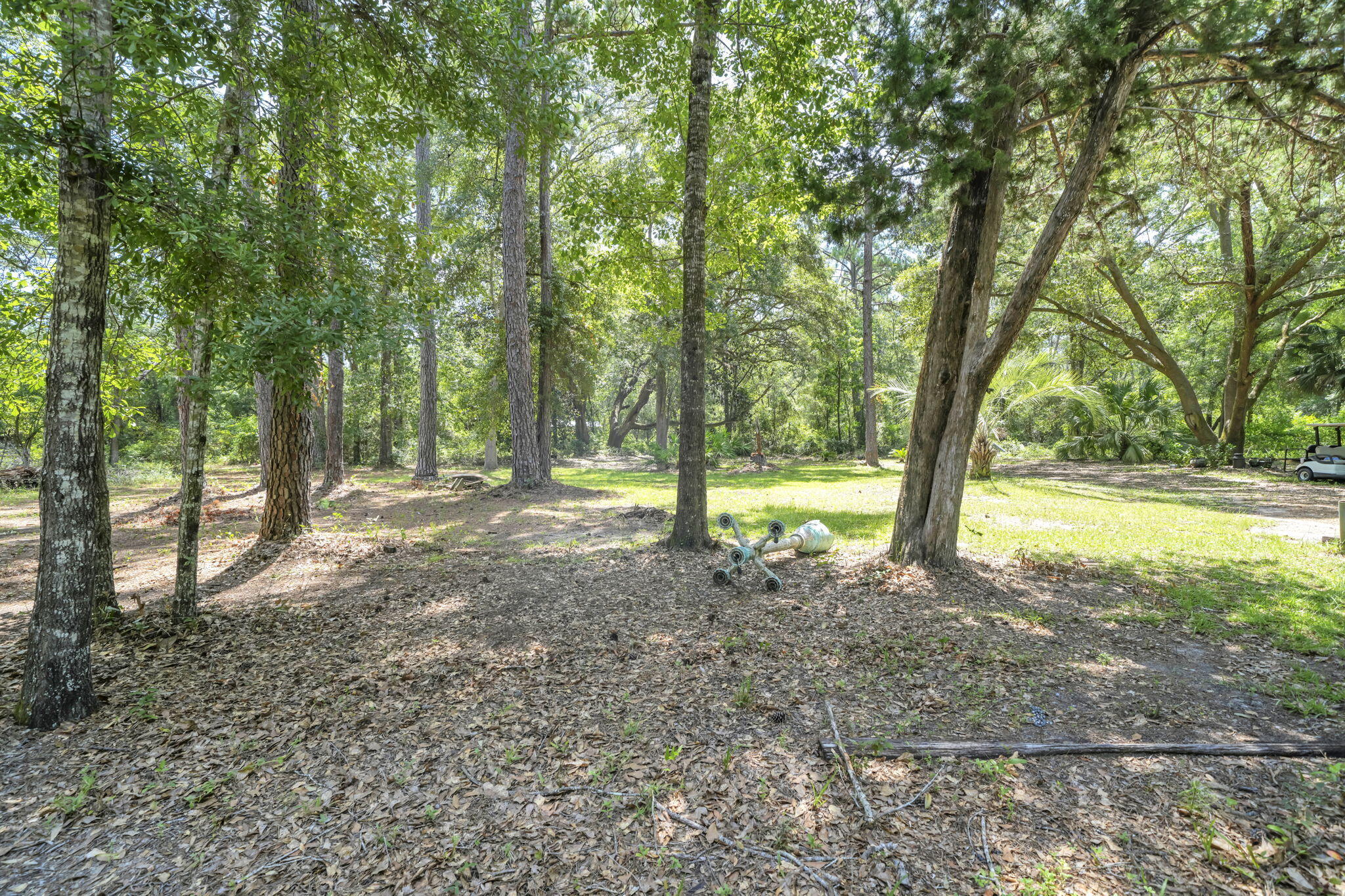Discover the rare opportunity to own over 4 acres of beautiful, private land at 41 Frogs Road in one of Freeport's fastest growing areas. Surrounded by lush native trees and tucked away from the hustle and bustle, this exceptional property offers the perfect blend of peaceful country living and convenient access to Freeport's expanding shopping, dining, schools, and town center. 

Designated **Estate Residential** under Walton County's Future Land Use Map, this property is ideal for creating a private estate, custom home, or generational family homestead while enjoying the space and privacy that acreage living provides. Whether you envision a hobby farm, gardens, a large workshop, RV or boat storage, or simply room to spread out and enjoy nature, this property offers endless possibilities. Buyers should verify all intended uses with Walton County.

Existing improvements include **city water**, an **existing septic system**, and an older mobile home that is currently livable but is being offered with **little to no contributory value**, making it an ideal property to enjoy while planning your future dream home.  Cleared areas are already in place while mature native trees create a beautiful natural setting with exceptional privacy.

Located in **FEMA Flood Zone X** (minimal flood risk), potentially reducing insurance requirements\. Enjoy quiet country living with easy access to Choctawhatchee Bay, the Emerald Coast's beaches, boating, fishing, shopping, and dining.
