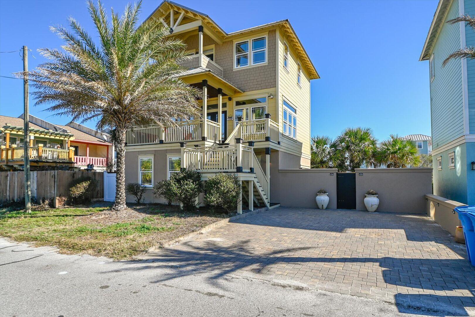 Ideally positioned just one block from public beach access, this Panama City Beach home offers a relaxed coastal lifestyle in a sought-after location. Featuring four bedrooms, three full bathrooms, a heated spa-style pool, and generous outdoor living space, the property is well suited as a primary residence, second home, or vacation rental, with no HOA or rental restrictions.

Designed for both everyday comfort and entertaining, the thoughtfully planned three-level layout includes multiple living areas, allowing for easy gathering or quiet retreat throughout the home. The main entrance on the second floor opens to a welcoming living and dining space that flows into the full-size kitchen with bar seating, complemented by a spacious deck ideal for al fresco dining. The third floor serves as a private primary retreat, featuring a spacious bedroom, a well-appointed bathroom with a garden tub and walk-in shower, and access to a covered deck offering Gulf views. The first floor includes two guest bedrooms--one with two sets of bunks and a twin bed--a full bathroom with a walk-in shower, and an expanded living area that provides bonus accommodations for family and guests.

Outdoor living is enhanced by the heated spa-style pool and outdoor shower, creating a seamless transition from beach days to evenings at home. The South Lagoon public boat ramp is just minutes away, offering convenient access for boating and water activities, while popular local restaurants and St. Andrews State Park are a short walk or bike ride away, with scenic trails, pristine beaches, and abundant outdoor recreation.