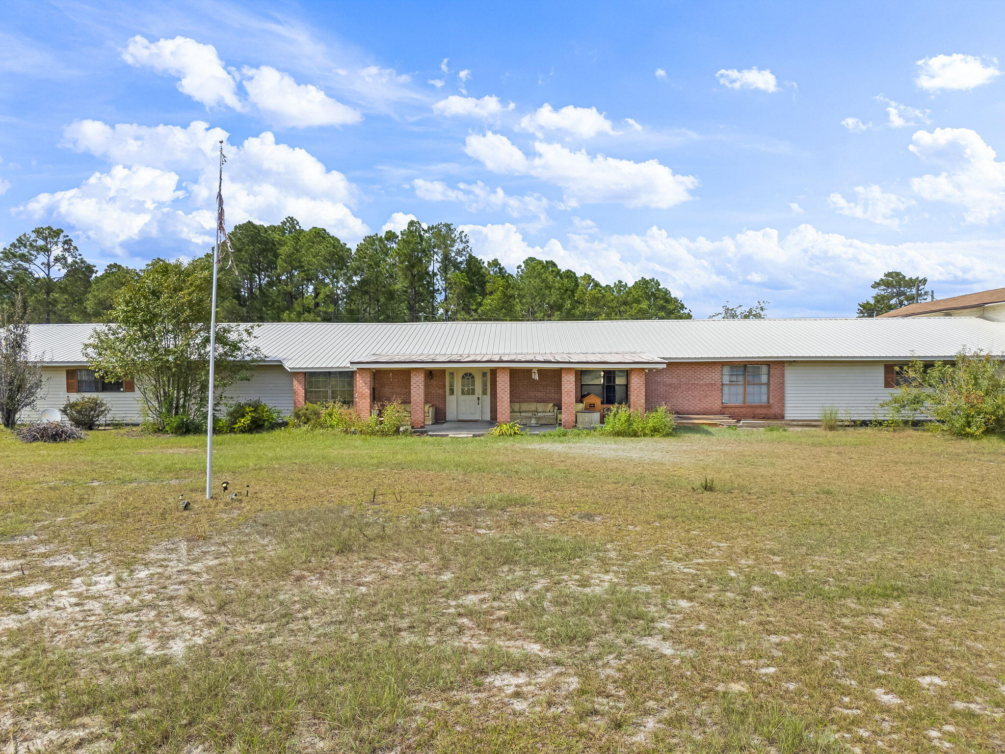 Sprawling 6,200+ sq ft home tucked away on a quiet cul-de-sac with the rare opportunity to purchase approximately 3, 5, or up to 7 acres. This unique property offers endless potential for a private estate, multi-generational living, investment opportunity, or future renovation project.

The home is currently comfortable and fully livable while offering the perfect canvas for remodeling and customization. Approximately 5,500 sq ft of the main living area is serviced by central heat and air and features a spacious floor plan ideal for a large or extended family. An additional upstairs mother-in-law suite includes a private entrance and its own private library, creating excellent flexibility for guests, rental income, or independent living arrangements.

Located in a rapidly growing area, an upscale master-planned subdivision is being developed less than a quarter mile east of the property, while a golf course community borders the south side. Despite the growth nearby, this property maintains the privacy and freedom of county living with no HOA restrictions.

Bring your vision and make this hidden gem your own. Properties with this much land, square footage, flexibility, and future potential are increasingly hard to find. Property is occupied and shown by appointment only. Seller is related to the listing agent.