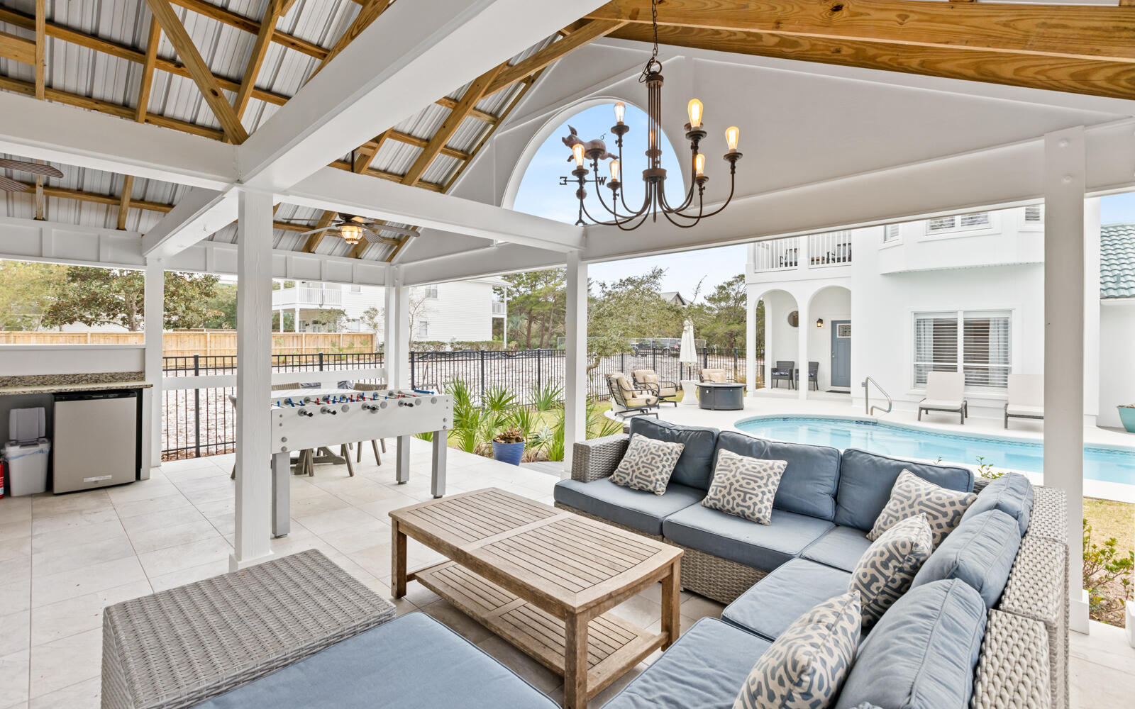 Located in a prestigious Blue Mountain Beach neighborhood with dedicated beach access, this fully furnished 4-bedroom, 3.5-bath home offers versatility for full-time living, a second home retreat, or a rental investment. The remodeled home boasts a new roof in 2025. Currently on a rental program with solid performance and upcoming bookings in place, it provides flexibility from day one. The open-concept main level connects the living, dining, and chef's kitchen featuring GE Café appliances and generous prep space. A full guest bedroom and marble-tiled bath are located downstairs for convenience. Upstairs includes a private guest suite with balcony and a spacious primary suite with marble flooring, oversized marble shower, dual patio access, and an owner's closet. A bunk room increases overall sleeping capacity. All bathrooms feature marble-tiled showers and quartz counters.

The fully fenced backyard is designed for both privacy and gathering, centered around a heated chlorine pool with a new 2026 heater, outdoor shower, firepit, and a dedicated pool house designed with entertaining in mind, complete with a half bath. The layout creates a true indoor-outdoor living experience.

Key updates include a 2025 tile roof, 5-6-year-old HVAC, 3-year tankless water heater, security system, sprinkler system, finished garage floors, and a 2025 beverage chiller. A two-car garage plus driveway and front parking provides space for 8 to 9 vehicles, a rare advantage in this area.

Whether you are seeking a primary residence near the beach, a second home with room to host, or a property with rental potential, this Blue Mountain Beach home delivers location, infrastructure, and flexibility in one complete package.


All information is deemed reliable and provided for informational purposes; buyers are encouraged to independently verify all details.
