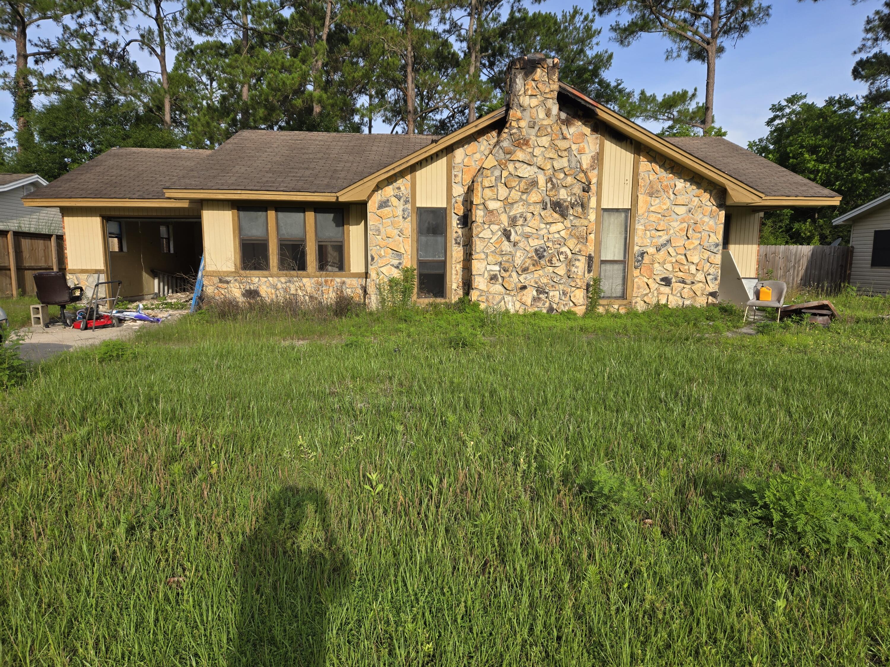 Bring your contractor to rebuild this house~ The house burned and the brick exterior appears to be in decent condition~   This property is just waiting to be rebuilt~