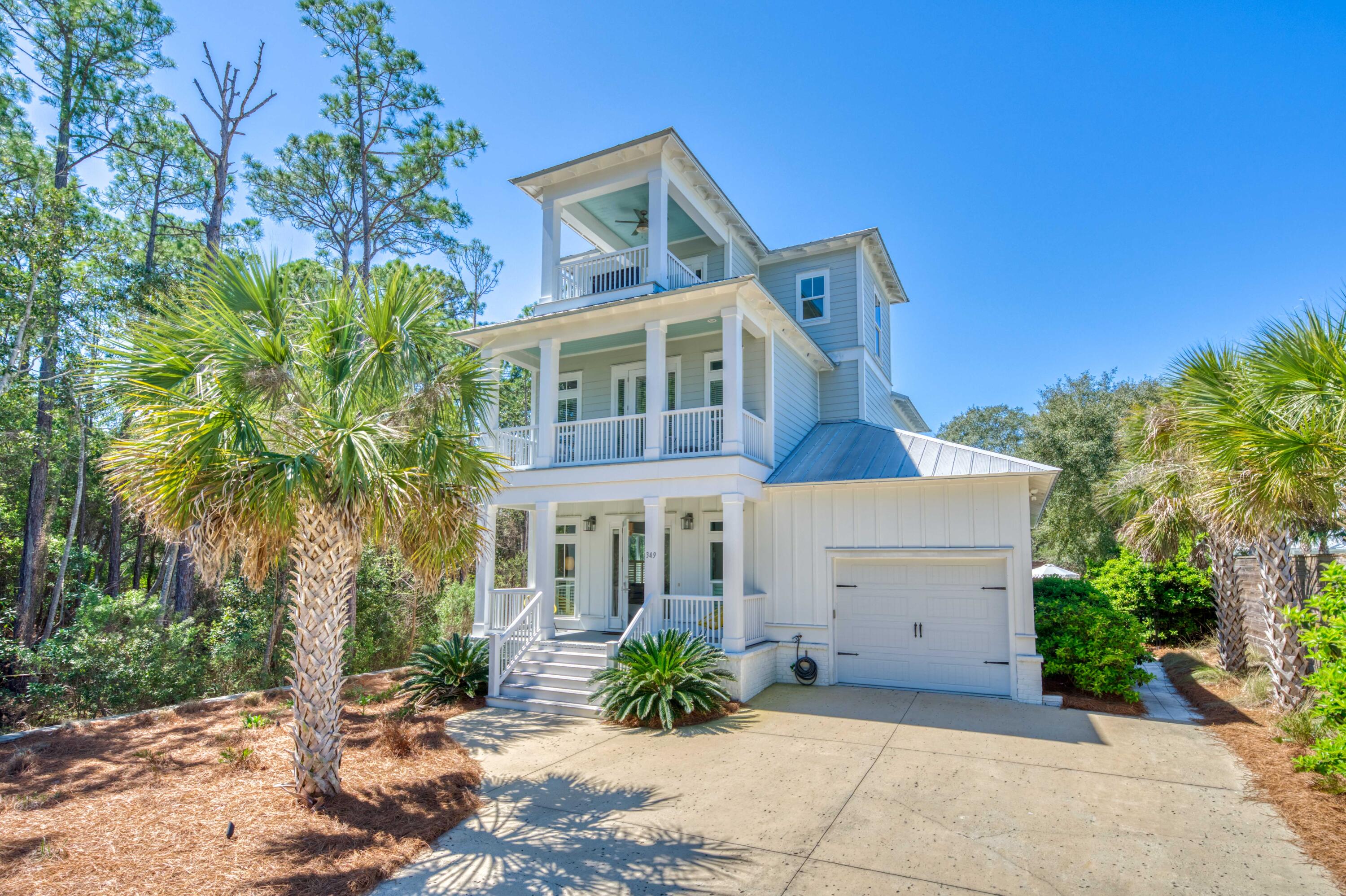 Located less than 1,900 feet from the beach access, 349 Seacrest Drive delivers an unmatched blend of high-end luxury and absolute privacy on a rare half-acre lot. Perfectly positioned on the coveted east end of 30A between Alys Beach and Rosemary to the east, and Seagrove and Seaside to the west, this pristine 2,983-square-foot estate features a spectacular resort-style heated pool oasis, a gas fire pit, built-in gas grill, and a Big Green Egg framed by lush, private landscaping.

Inside, rich hardwoods, warm coastal finishes, and shiplap walls complement a grand open-concept layout filled with natural light. The heart of the home is a massive chef's kitchen featuring a gas range, a large center island seating five, and an adjacent wet bar equipped with an ice maker, mini fridge, and prep sink. The main-level primary suite serves as a true spa sanctuary with a deep soaking tub, custom-tiled walk-in shower, double vanities, and a large walk-in closet. The upper levels offer premier accommodations, including three spacious guest suites, each with its own private ensuite bathroom, and a stylish third-floor loft featuring custom-built queen-over-queen bunk beds, a full bath, and a private balcony. Located just a short distance from world-class dining, boutique shopping, and the vibrant family events at The Big Chill, this turnkey property is the ultimate 30A lifestyle property.