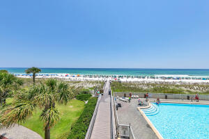 Awesome panoramic direct gulf front views from your balcony and great views from the living room as well. This lovely condo is your ticket to the fabulous beach lifestyle. Located right above the beach board walk for watching all the activity. Floor to ceiling glass in the living room maximize natural light and view.   One bedroom condos are seldom available at Waters Edge so don't miss this rare opportunity to make vacation memories and/or cash $$$$ in on rentals. With hall bunks and a sleeper sofa this condo accommodates up to 6 guests. Top quality poly wood furniture on the balcony. Great amenities include beach access, 2 seasonally heated pools, fitness center , and grilling area. Covered parking is available on the 3rd floor of the parking garage for premium access to your condo. Coastal rated AC compressor installed July 2020.