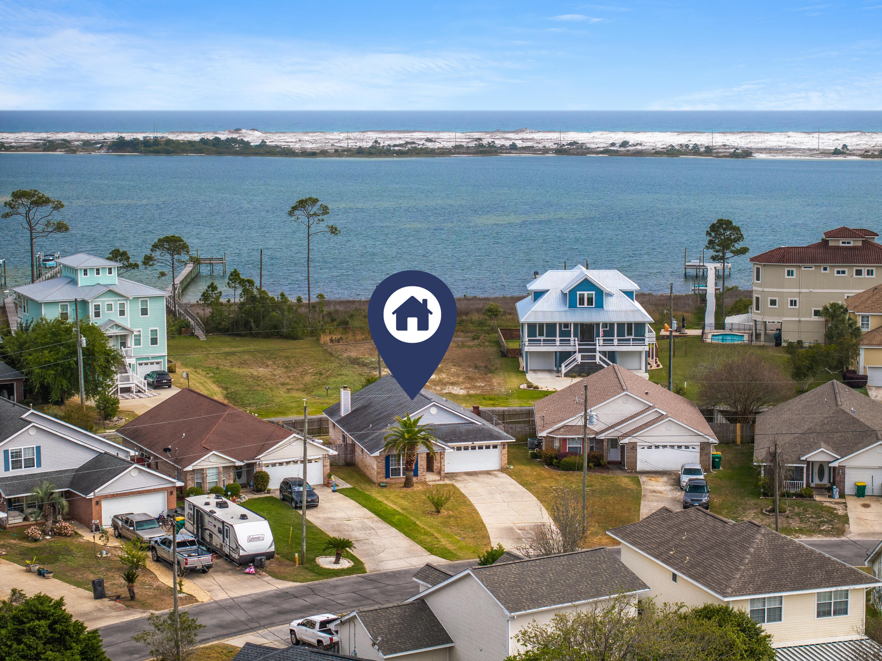 Minutes from Hurlburt Field AFB and the sugar-white beaches of the Emerald Coast, this move-in ready home offers comfort and coastal living. Backing to a peaceful walking path along the sound and Intracoastal Waterway with access to a nearby private sound beach, enjoy added privacy and relaxation. Features include brand-new LVP flooring throughout with no carpet, high ceilings, cozy fireplace, open-concept layout, split floor plan, fenced yard, extended driveway, granite countertops, farmhouse sink, updated appliances, brand-new refrigerator, and active termite bond!