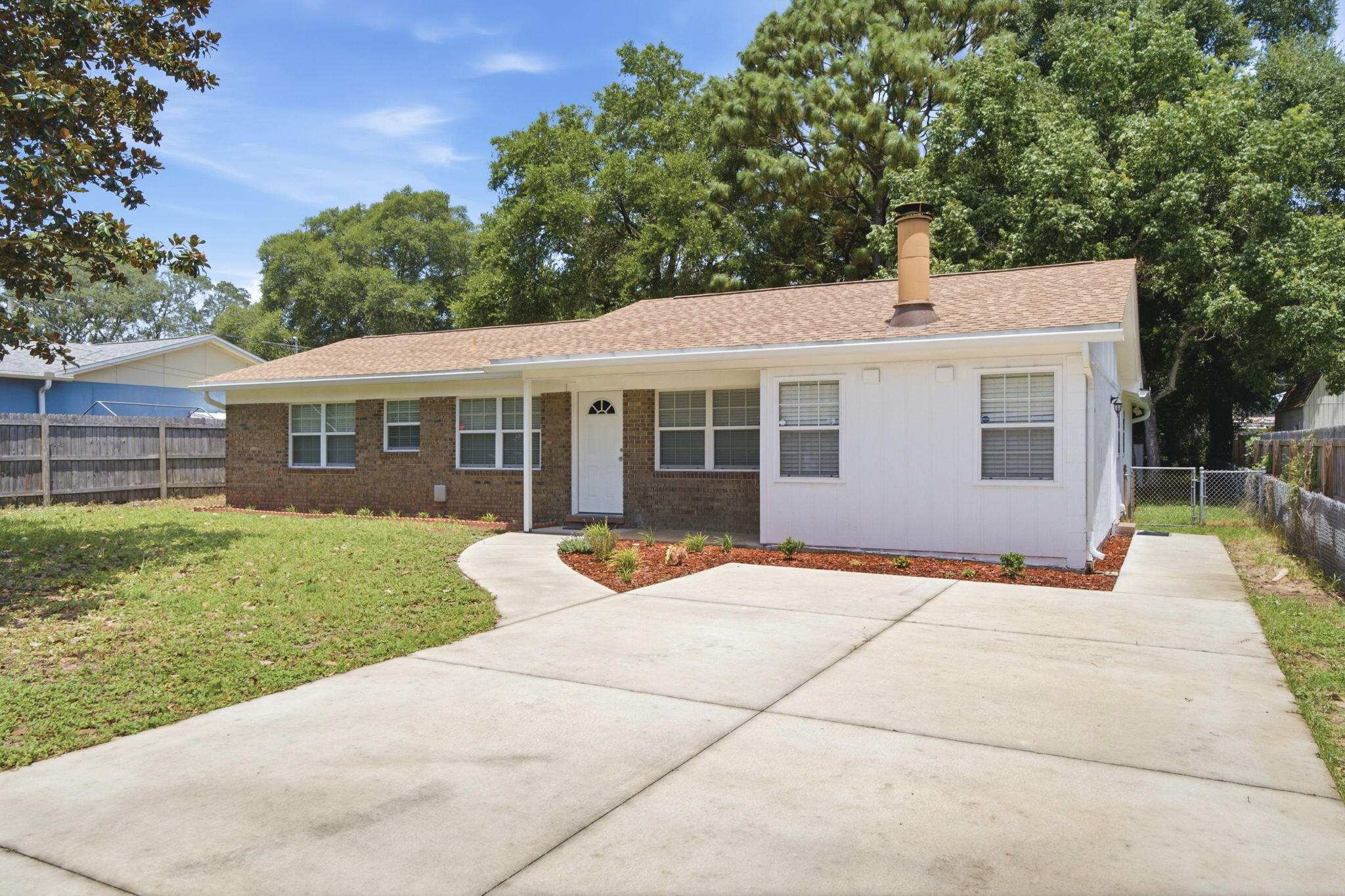 This home is ready for its new owner! Nicely updated home in Shalimar, close to shopping, restaurants and Eglin Air Force Base as well as Hurlburt. This home features a quiet, wooded and fenced lot. Home has updated tile flooring and carpets. Newer stainless steal appliances and mosaic backsplash tile in kitchen. This home offers a 4th bedroom and split floor plan with a half bath in second master. Functional fireplace in split living room/den area. Updated windows, hvac was replaced in 2023. Gutters around the home with an open extended paved patio. Sheds are to convey as-is. Schedule your showing today!