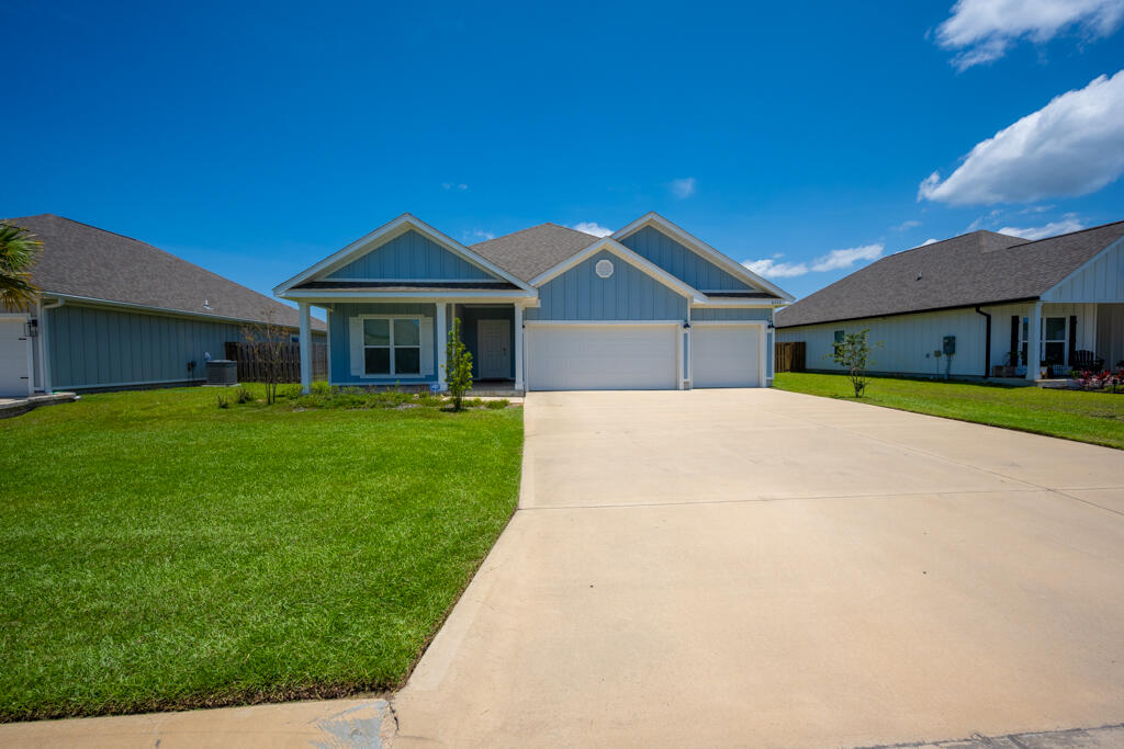 Welcome to 6430 Forest Bay Ave in the highly sought-after Forest Bay Estates of Gulf Breeze! Built in 2022, this beautifully designed Destin floor plan offers 4 bedrooms, 3 full bathrooms, over 2,300 square feet of thoughtfully designed living space, and a desirable 3 car garage. The open concept layout is perfect for both everyday living and entertaining, featuring a spacious family room that flows seamlessly into the chef's kitchen complete with granite countertops, stainless steel appliances, a large center island with bar seating, abundant cabinetry, and a generous walk in pantry. Enjoy meals in the breakfast nook or host gatherings in the separate formal dining room. The private primary suite offers a spa inspired bath with dual vanities, a garden tub, separate walk in shower, and an oversized walk in closet. Three additional bedrooms and two full baths provide plenty of space for family and guests. Luxury vinyl plank flooring runs throughout the main living areas with carpet in the bedrooms for added comfort. Step outside to the covered rear patio overlooking the backyard ideal for relaxing or entertaining year round. Residents of Forest Bay Estates also enjoy access to a community pool and a convenient location just minutes from top rated schools, shopping, dining, beaches, military bases, and all that the Gulf Coast has to offer. This exceptional home combines modern style, functionality, and location in one outstanding package.