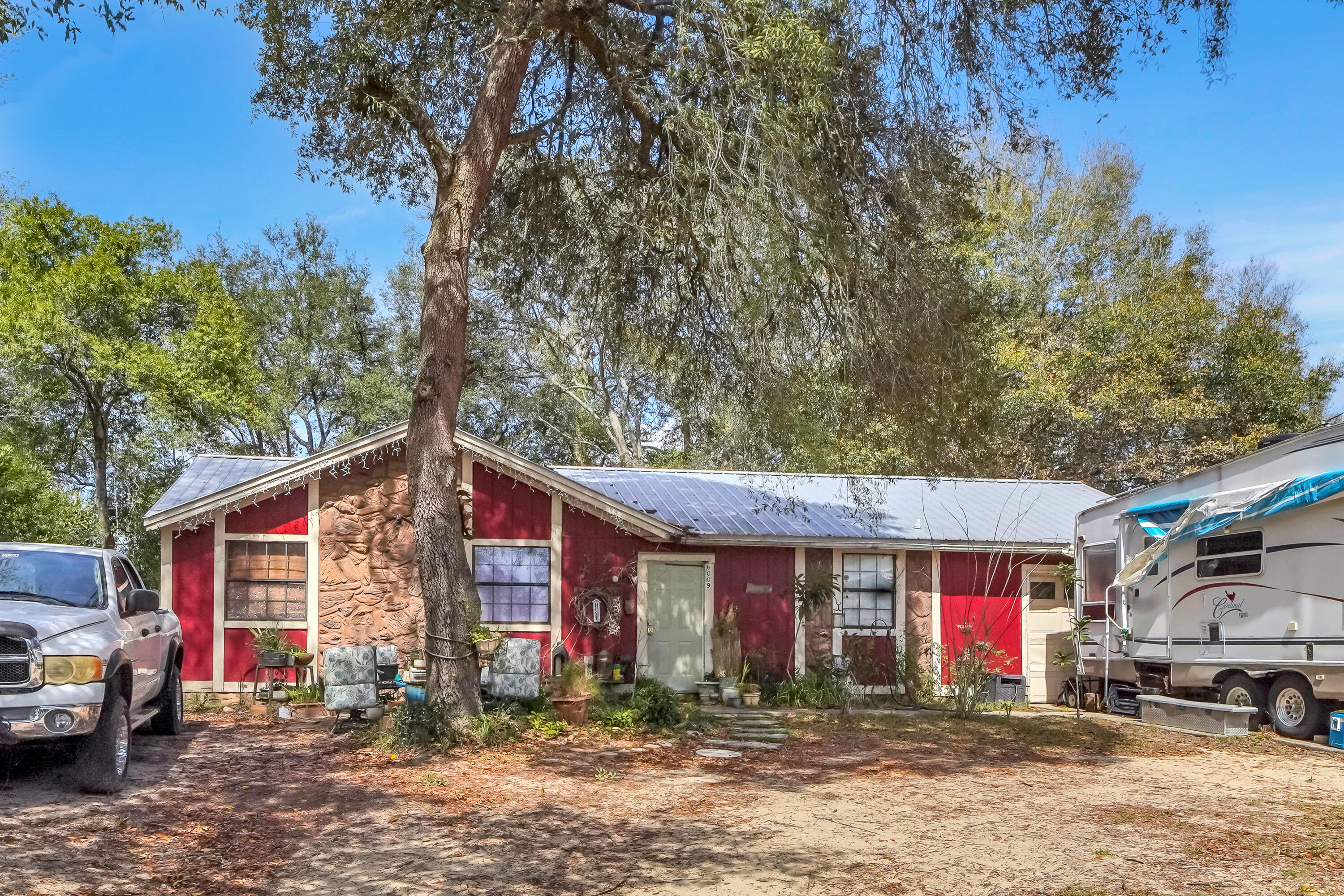 3 Bedroom 1.5 bath rental property in Milton FL.  Property includes a fire place in the living room, kitchen appliances, and a fenced in back yard.