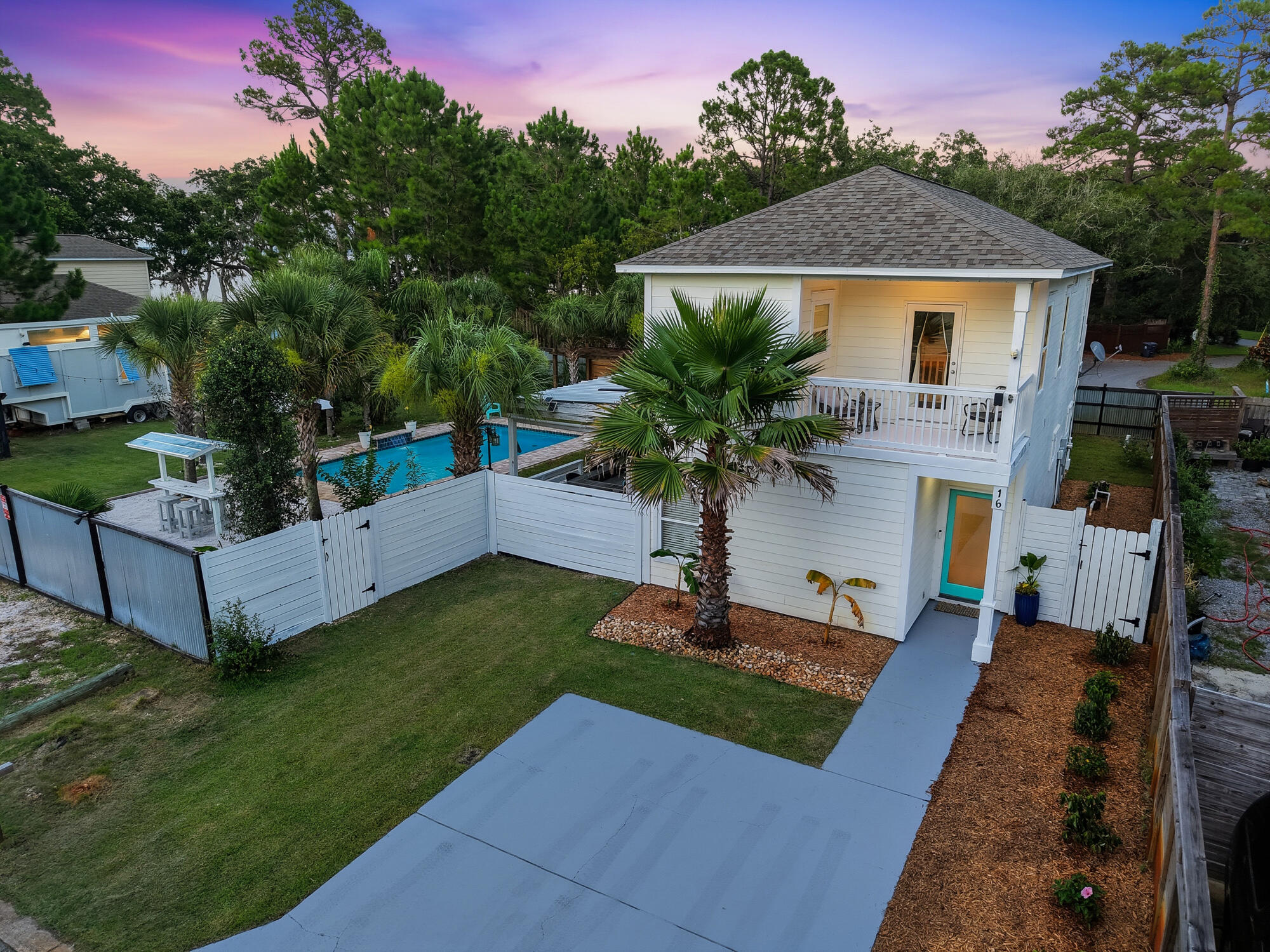 16 Pine Tree Way, Santa Rosa Beach - Rare Multi-Lot Opportunity
This exceptional property offers a unique blend of space, updates, and lifestyle features. Situated on three lots/two parcels, it provides expansive grounds with no HOA restrictions, giving you maximum flexibility and privacy.
Key Features Include:
Comes fully furnished with acceptable offer!
•  Fully Remodeled Main Home (Ceiling to Floor): Stunning 3-bedroom, 3-full-bath residence completely updated with new kitchen cabinets, backsplash, and appliances; remodeled bathrooms; new trim, fresh paint, and smoothed ceilings throughout. Balconies and driveway have been recently painted.
•  In-Ground Pool & Poolside Bar: Stunning new pool (2021) with a dedicated bar area featuring multiple TVs perfect for watching sports games and entertaining guests.
•  Tiny House: Adorable guest tiny home built in 2022 with bay views. It includes water and electric hookups plus a washer and dryer. The tiny home is private property but can convey with an acceptable offer.
•  Additional Building Potential: The area where the tiny home is located allows for construction of another home and/or a two-car garage with carriage house.
•  Bay Views: Enjoy serene bay vistas from both the main home balcony and the tiny house.
•  Fully Fenced Property: Privacy and security with a new fence installed in 2021.
•  Abundant Parking: Tons of off-street parking for guests, boats, or multiple vehicles.
•  Recent Major Updates:
 •  New HVAC system (2025) New roof (2023)
 New hot water tank (2023)
 New pool (2021)
 New fence (2021)
 Tiny house (2021)
Additional Highlights:
Hardy wood siding for durability and classic coastal charm
Irrigation system powered by a private well
Shed on the property for extra storage
No HOA - enjoy freedom for future projects or rentals

This versatile Santa Rosa Beach property is ideal for families, entertaining, multigenerational living, or investment potential with its spacious layout across multiple lots, modern amenities, and desirable location. A true standout opportunity!