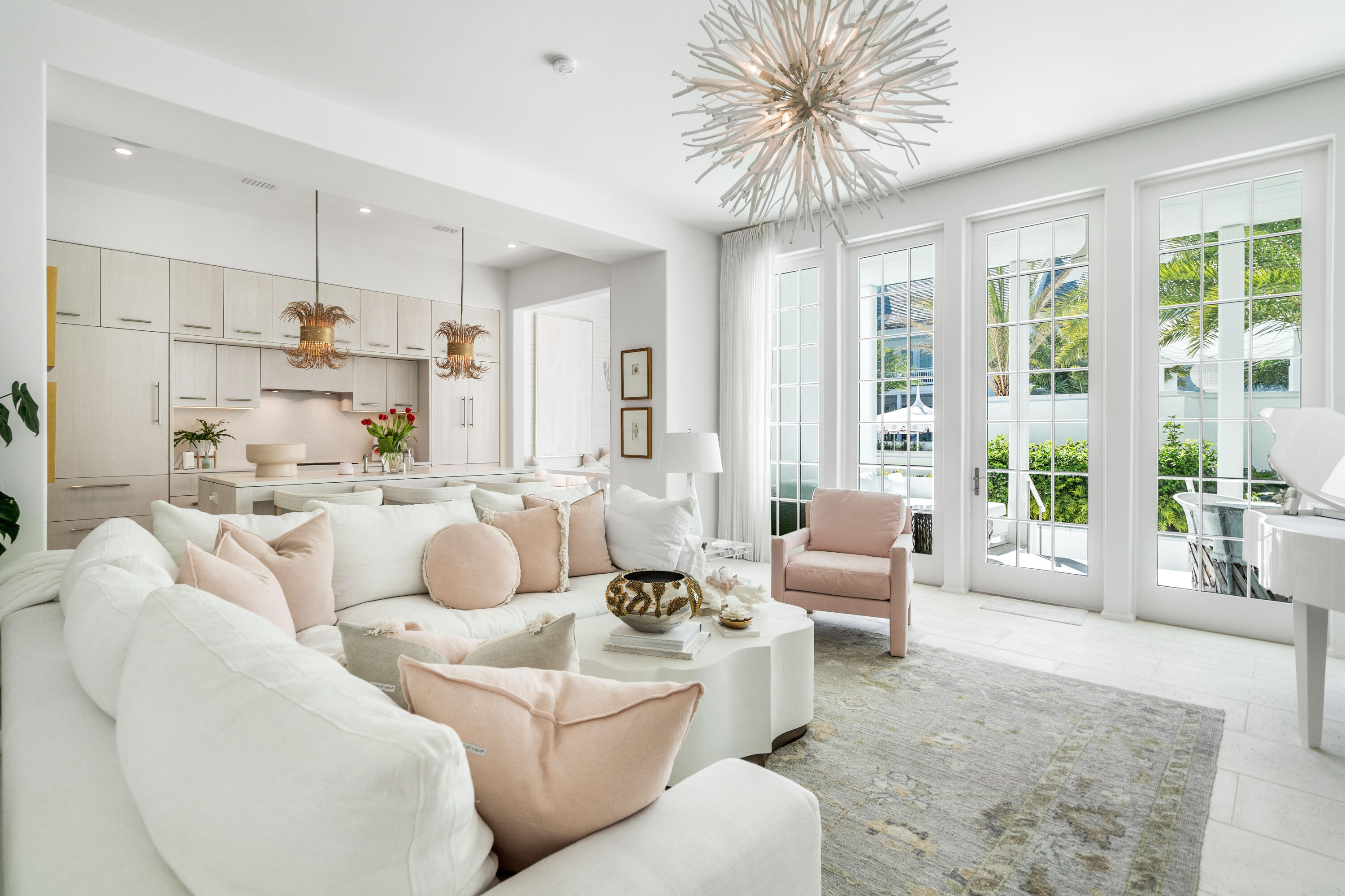This stunning residence at Kaiya Beach Resort, designed by Khoury-Vogt Architects and Bella Beach Interiors, overlooks the heated pool & is the only Mews residence currently available with direct pool views. The main level features 11-foot ceilings, expansive living & dining spaces, large-format concrete flooring, & a chef's kitchen appointed with Sub-Zero and Wolf appliances, Caesarstone countertops, & custom cabinetry. Every detail reflects refined craftsmanship & understated elegance, from the Waterworks fixtures to the white oak flooring & marble throughout the upper level. The current owner further elevated the interiors with Venetian plaster walls, designer lighting, designer fabric on window treatments, custom bedding, and curated wallcoverings by Phillip Jeffries, Thibaut, and Osborne & Little, adding warmth, texture, and character. Upstairs, 3 spacious bedroom suites and three full marble bathrooms provide privacy & comfort, all finished with the same elevated aesthetic found throughout the residence. Nearly 900 sq ft of covered terraces extend the living space outdoors for poolside views & entertaining. There is an oversized 2 car garage. Mews owners/guests still have access to the private Mews pool, grill area, and beach access without joining the Beach Club. Optional Beach Club membership includes additional  gulf-front infinity pool, rooftop pool at the residences, concierge beach service. Coming soon: 5,000 sq foot spa/gym  and the Lamuse d'or cafe!